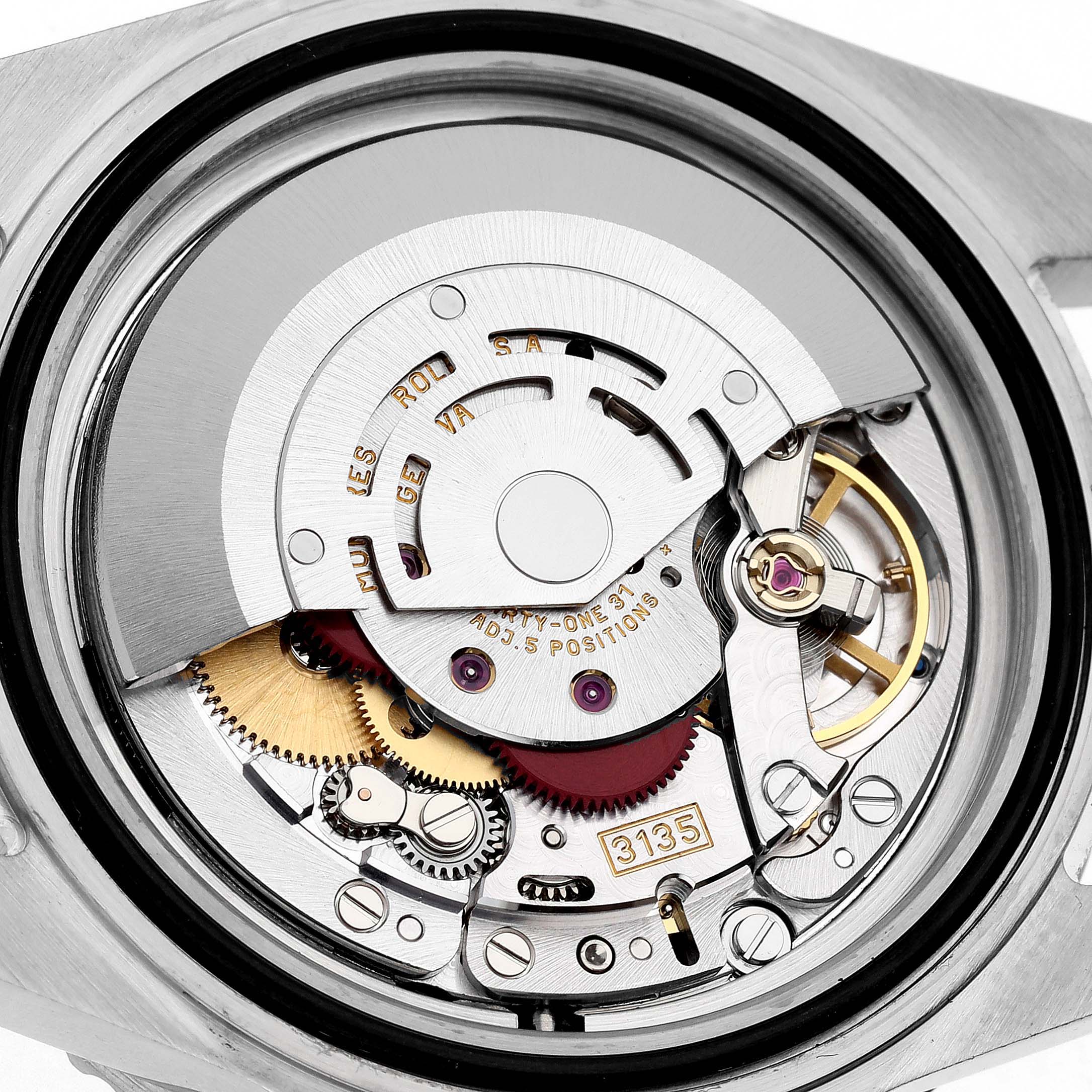 The image shows a top view of the movement mechanism inside a Rolex Submariner 16610 Men
s Stainless Steel Black Dial 16610 Men
s Stainless Steel Black Dial watch.
