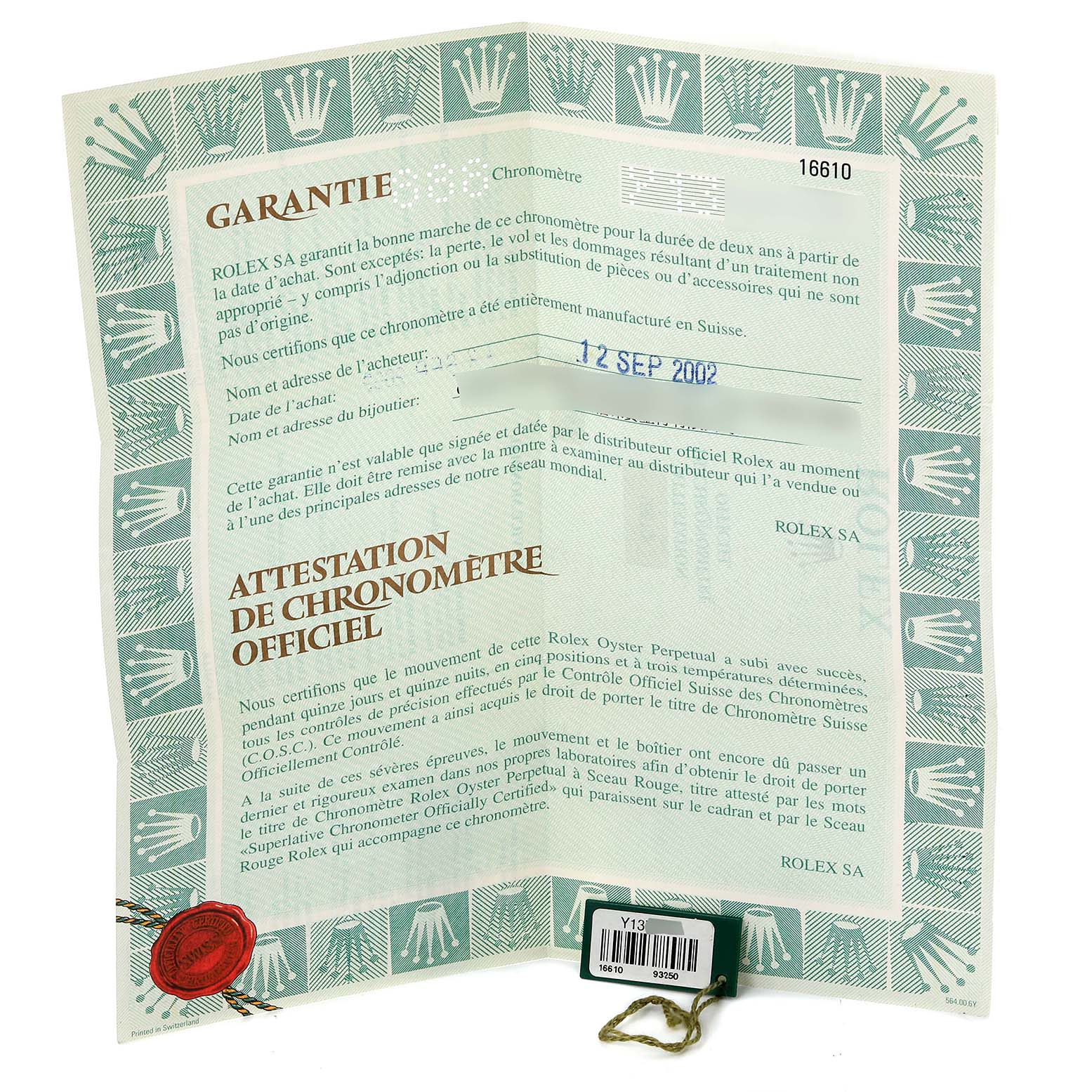 The image shows the warranty and chronometer certification documents for a Rolex Submariner 16610 Men
s Stainless Steel Black Dial 16610 Men
s Stainless Steel Black Dial model, including a red seal and a serial tag.