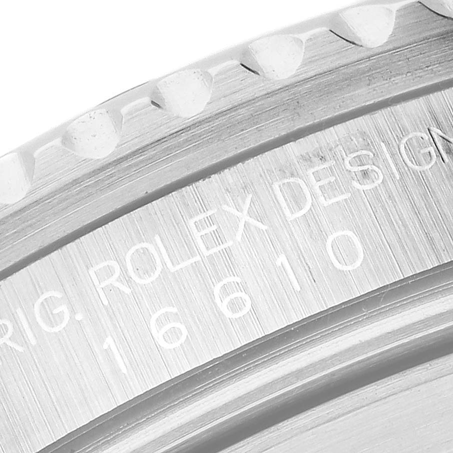 The image shows a close-up of the inner ring and bezel of a Rolex Submariner 16610 Men
s Stainless Steel Black Dial 16610 Men
s Stainless Steel Black Dial, displaying the model number 16610.