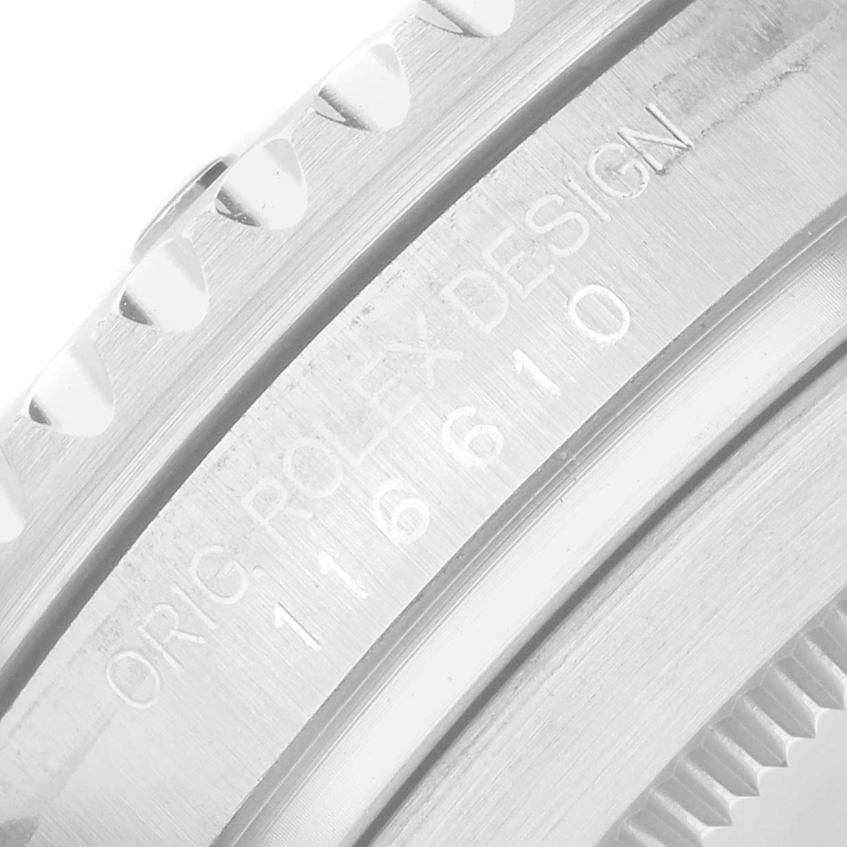 The image shows a close-up of the side engraving and bezel of a Rolex Submariner 116610 Men's Stainless Steel Black Dial watch.