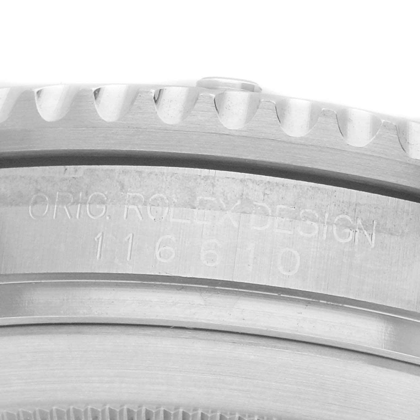 The image shows a close-up of the engraved side of the Rolex Submariner 116610 Men's Stainless Steel Green Dial's case, including the bezel edge.