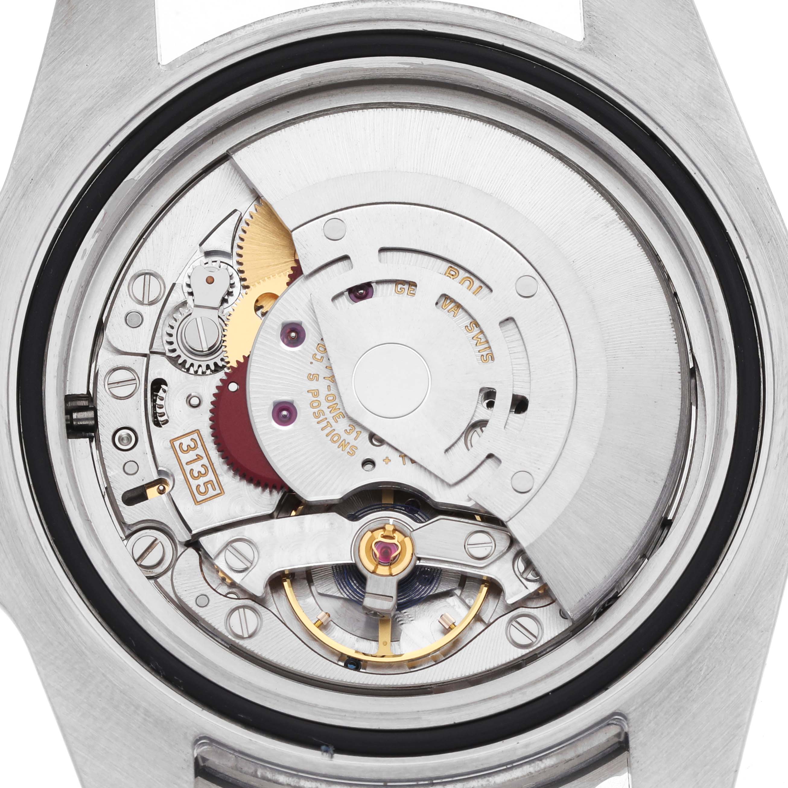 The image shows the internal movement mechanism of a Rolex Submariner 116610 Men's Stainless Steel Green Dial, viewed from the back without the case.