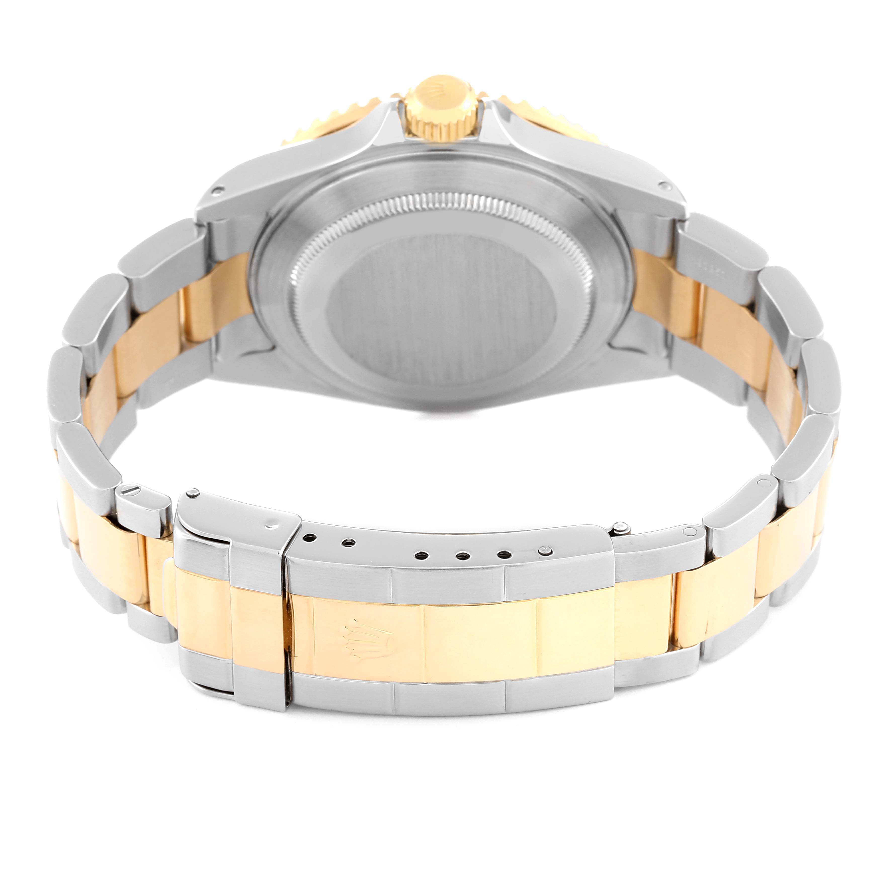 This image shows the backside and clasp area of a Rolex Submariner 16613 Men
s Steel and Gold (two tone) Black Dial 16613 Men
s Steel and Gold (two tone) Black Dial watch in two-tone gold and stainless steel.