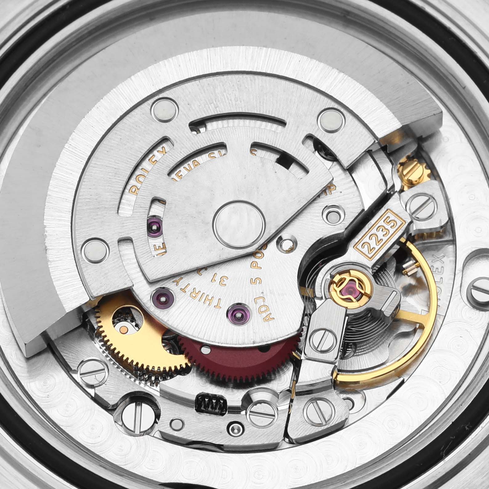 This close-up image of the Rolex Yacht-Master 168623 Men's Steel and Gold (two tone) Champagne Dial 168623 Men's Steel and Gold (two tone) Champagne Dial model showcases the intricate movement mechanism inside the watch.