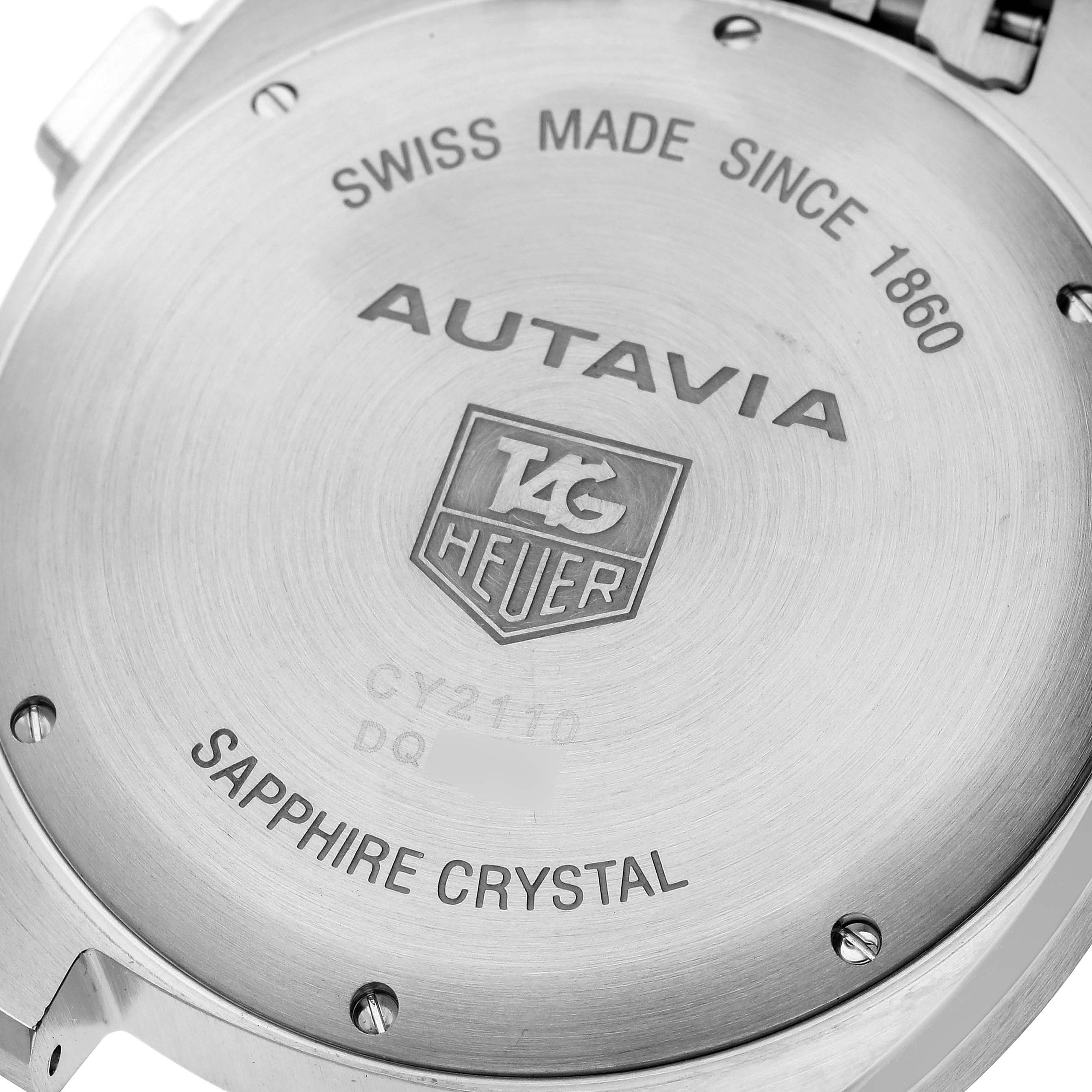 The image shows the back case of an Autavia model watch by Tag Heuer, highlighting the inscriptions and branding.