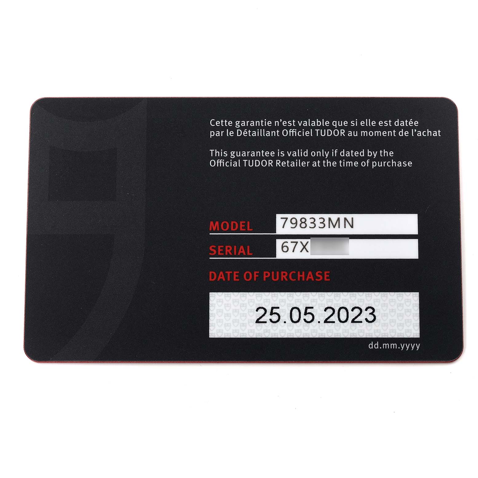 This image shows the warranty card for the Tudor Heritage Black Bay 79833MN Men
s Stainless Steel Black Dial 79833MN Men
s Stainless Steel Black Dial model 79833MN, displaying its serial number and purchase date.