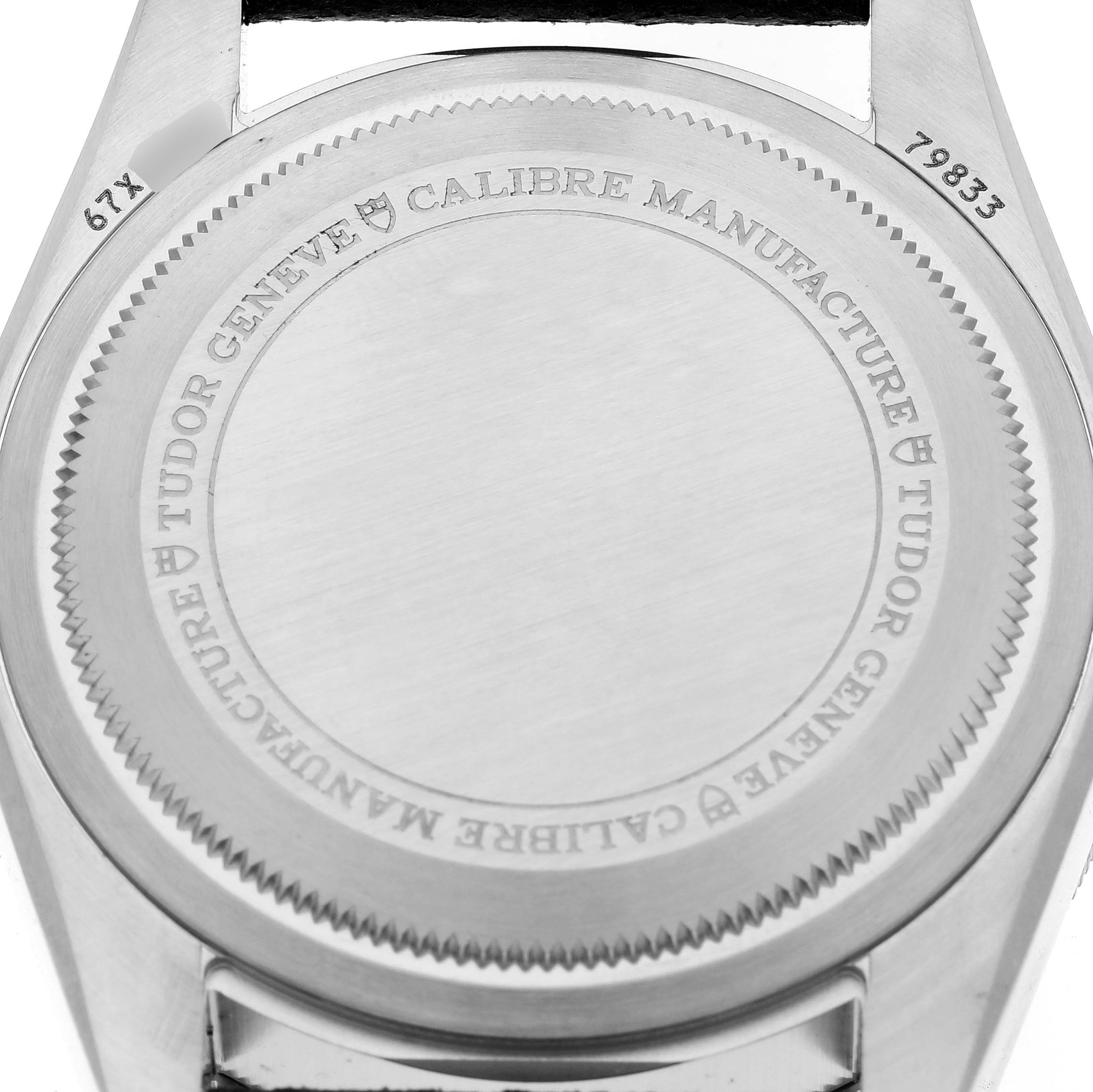 This image shows the back case of a Tudor Heritage Black Bay 79833MN Men
s Stainless Steel Black Dial 79833MN Men
s Stainless Steel Black Dial watch, featuring engraved details and the model number.