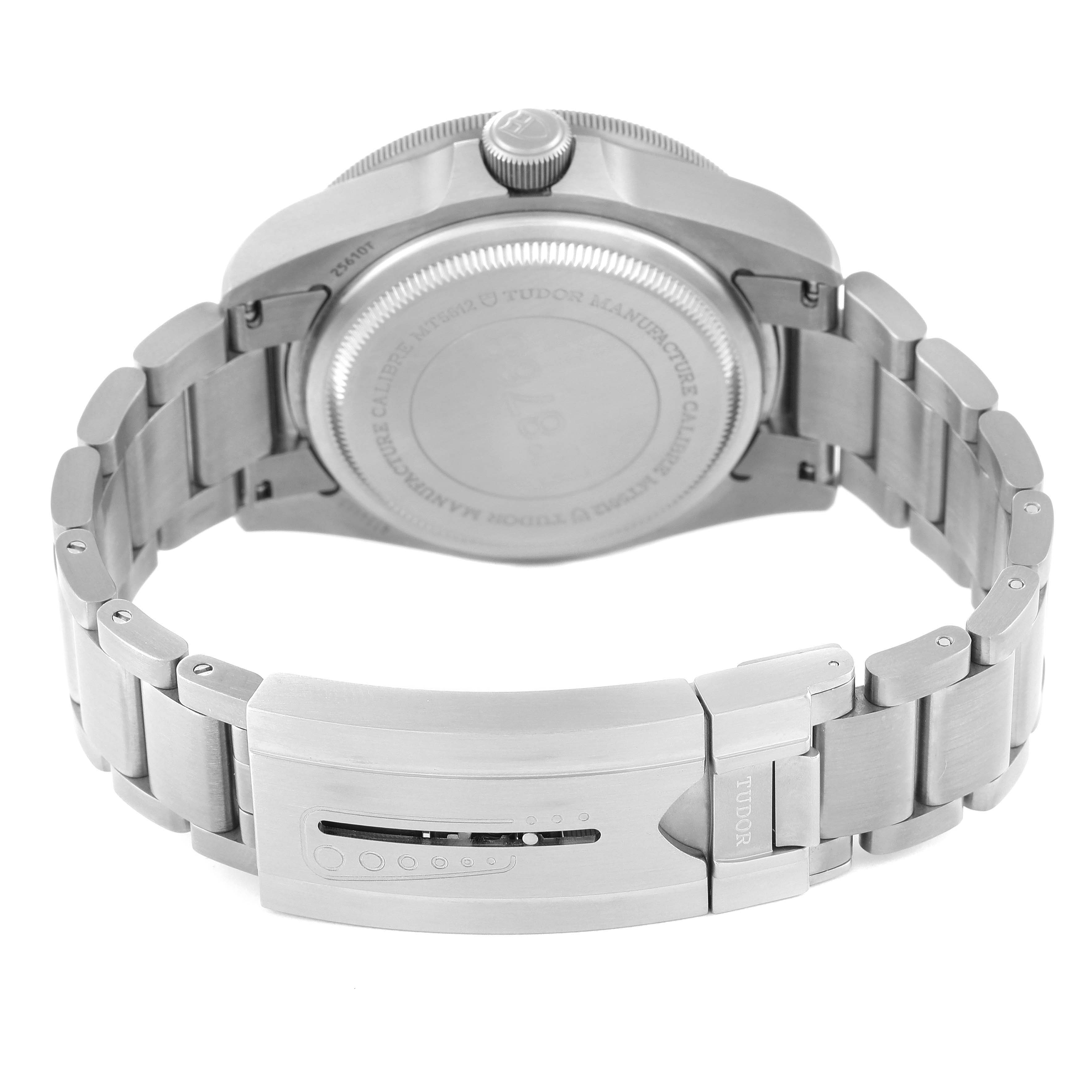 The image shows the back of a Tudor Pelagos 25610TNL Men
s Titanium Black Dial 25610TNL Men
s Titanium Black Dial watch, including the case back, crown, and metal bracelet with a closed clasp.