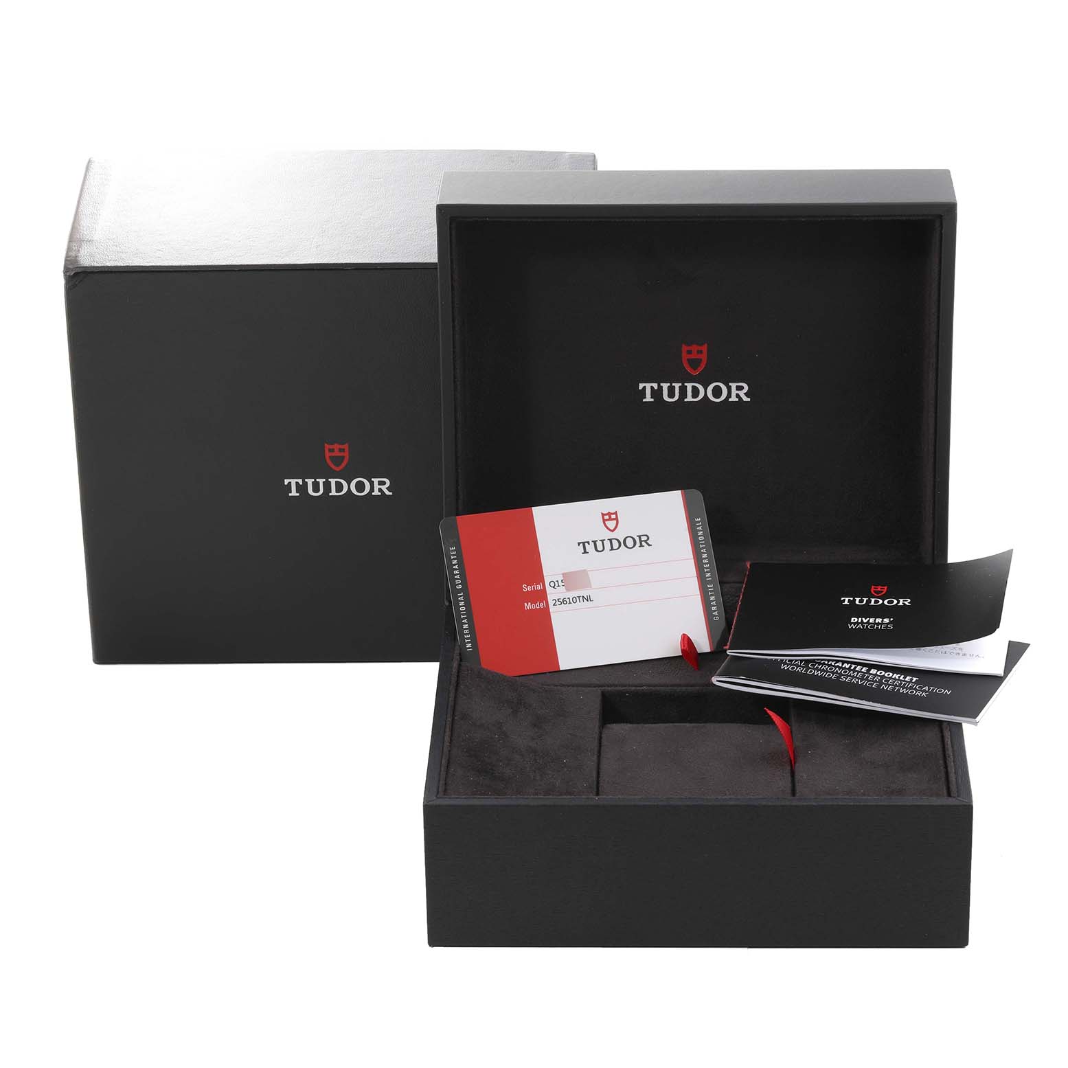 The image shows the open packaging and documentation for the Tudor Pelagos 25610TNL Men
s Titanium Black Dial 25610TNL Men
s Titanium Black Dial model watch from a front angle.