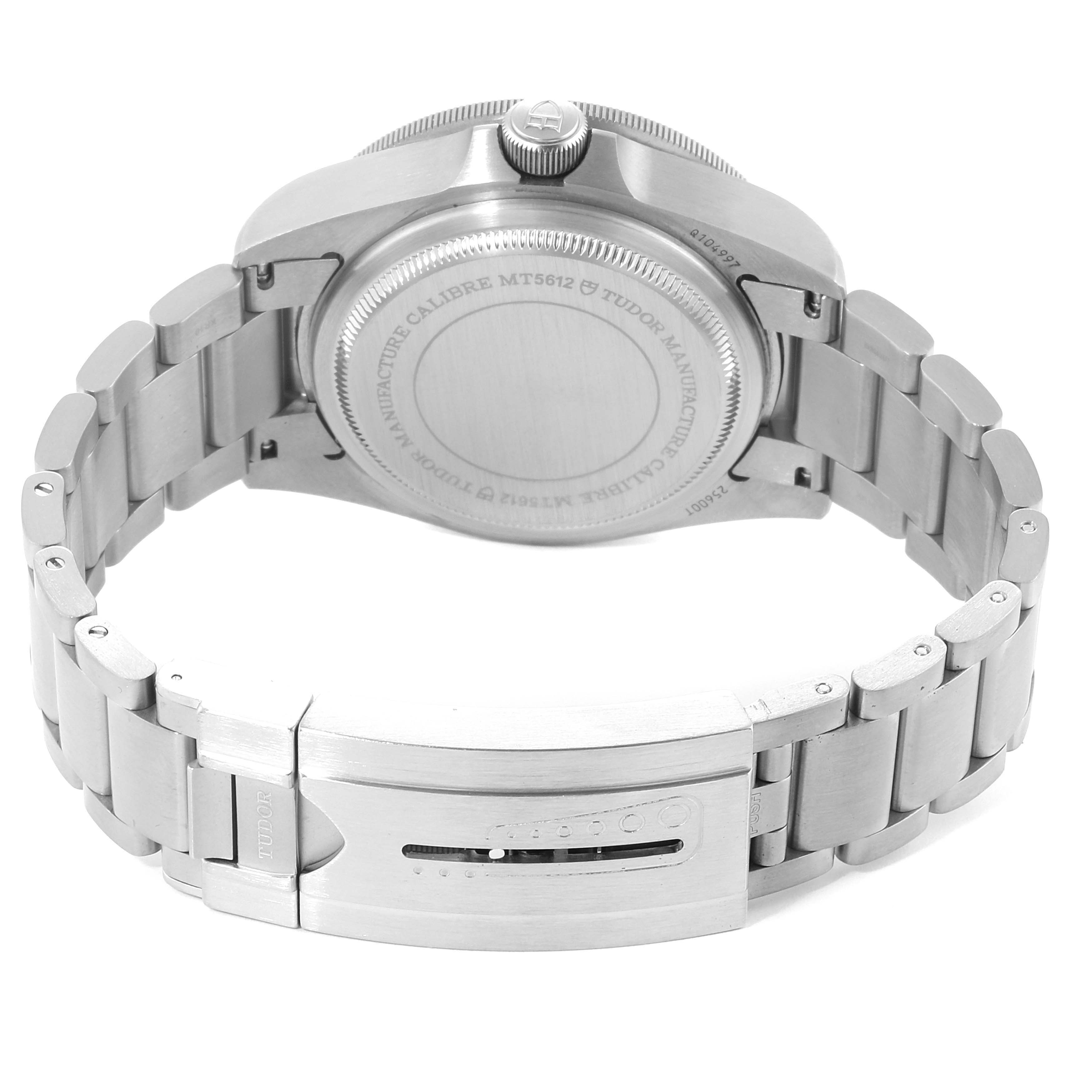 The image shows the backside of a Tudor Pelagos 25500TN Men's Titanium Black Dial 25500TN Men's Titanium Black Dial watch, highlighting its case back, crown, and metal bracelet with clasp.