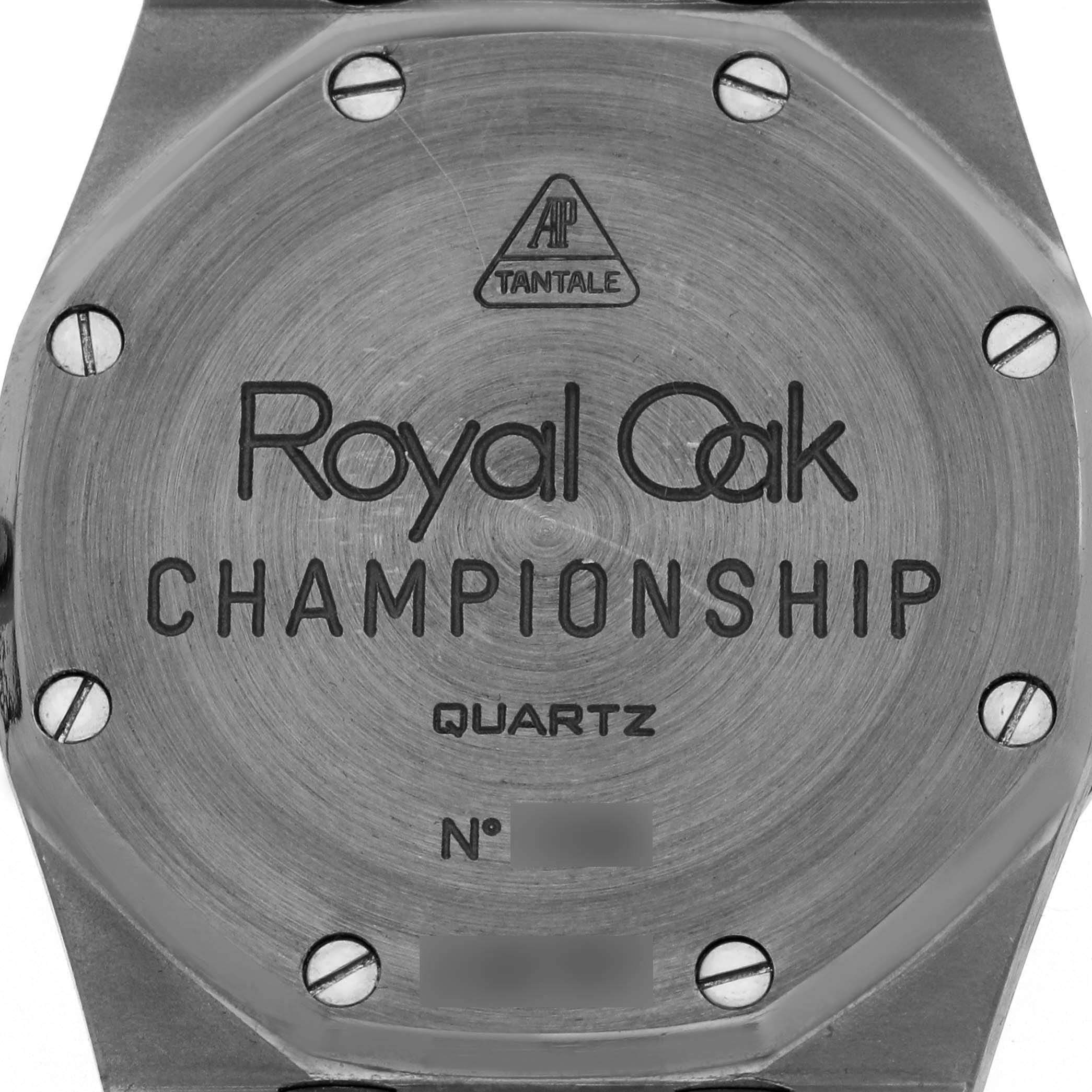 This image shows the back case of the Audemars Piguet Royal Oak 56175TT Men
s Stainless Steel Grey Dial Championship watch, featuring engravings and screws.