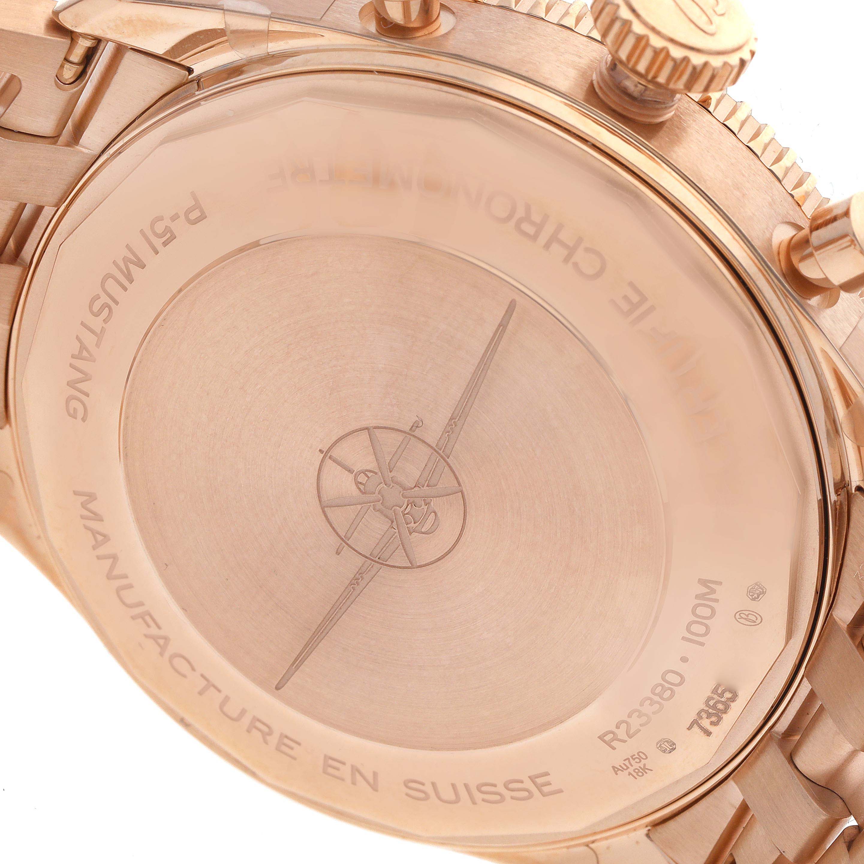 The image shows the back case of the Breitling Aviator R23380 Men
s Rose Gold Grey Dial watch, highlighting engravings and the crown.