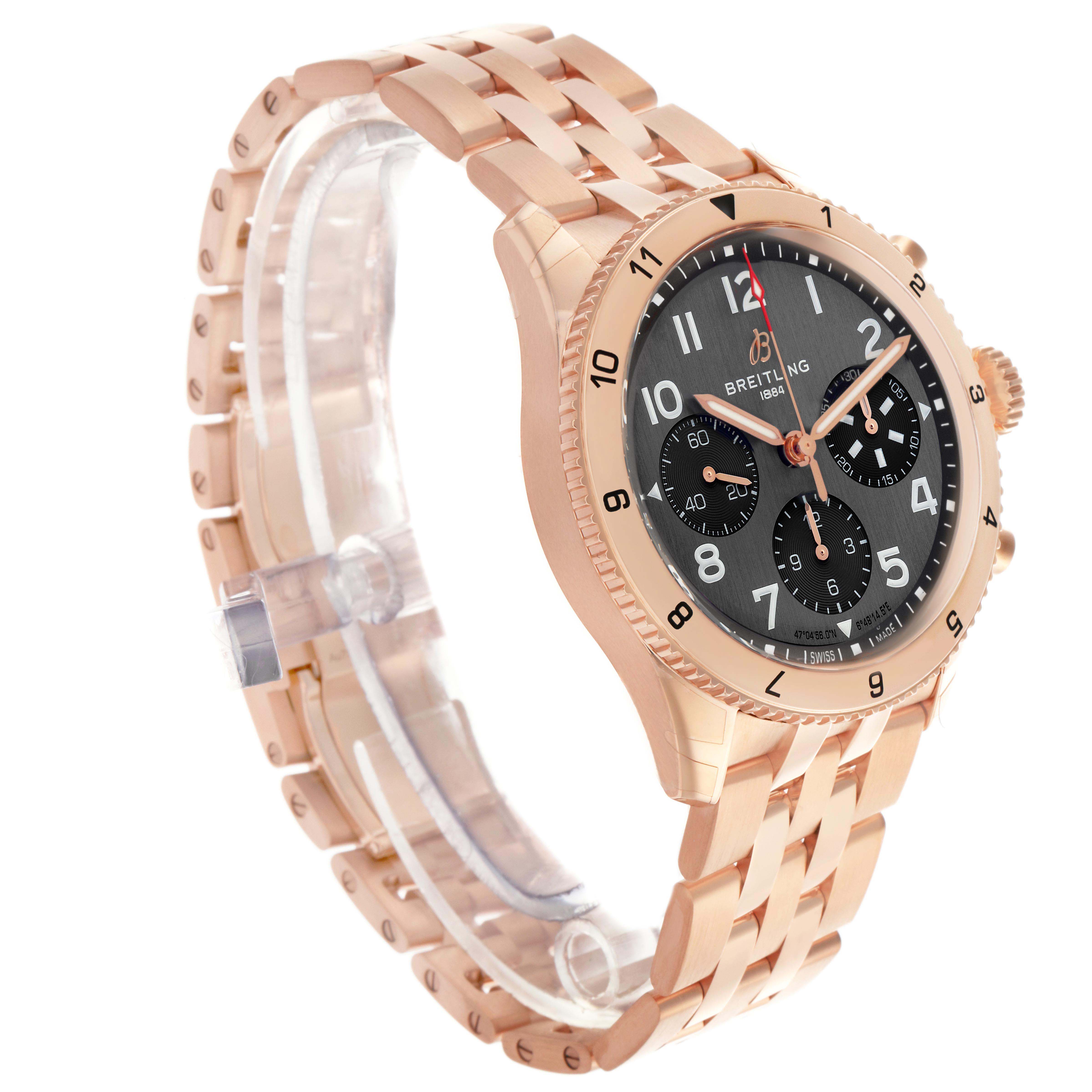 The Breitling Aviator R23380 Men
s Rose Gold Grey Dial watch is shown at an angled side view, displaying its rose gold case, black dial, bracelet, and bezel.
