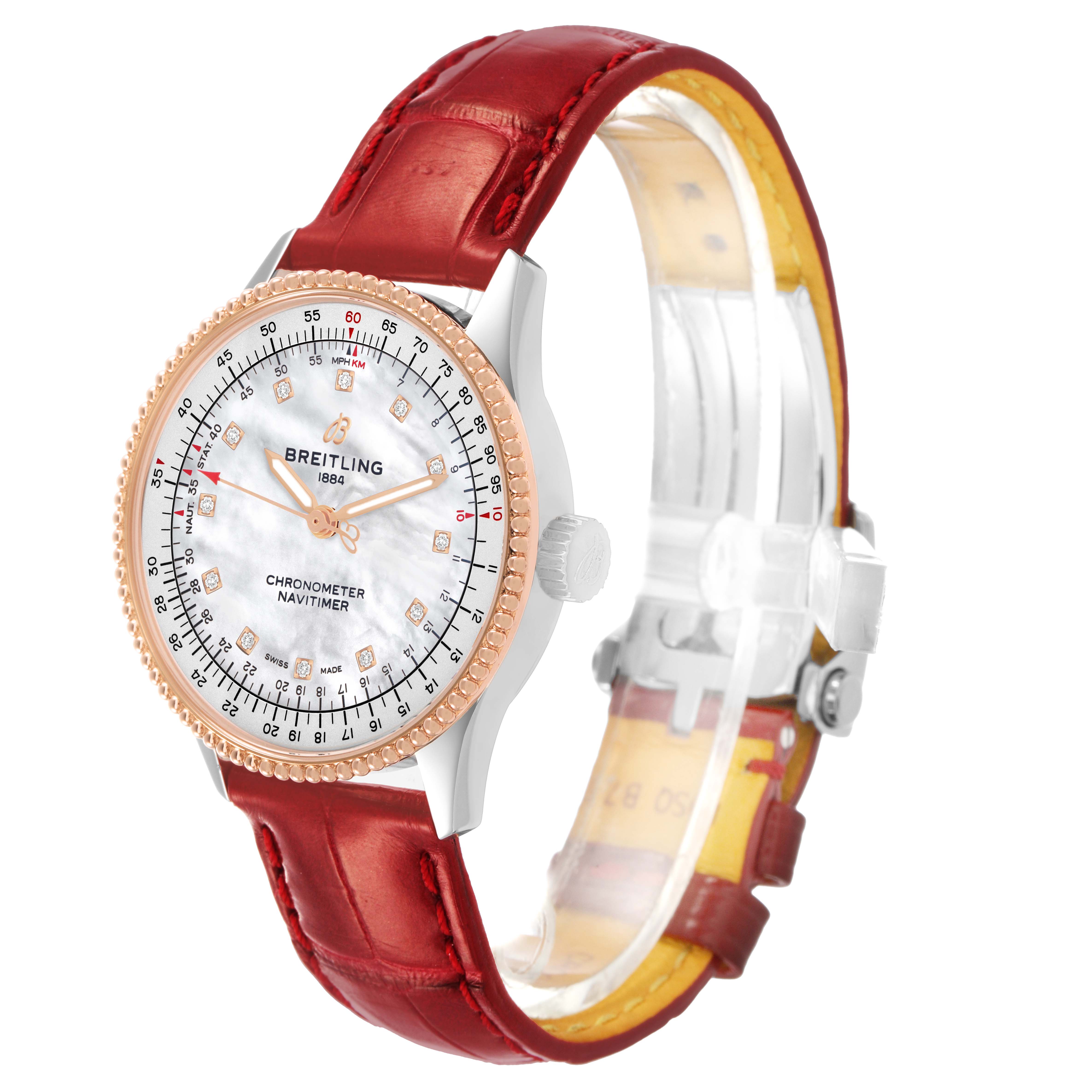 The Breitling U17395 Women's Stainless Steel Mother of Pearl Dial Navitimer 35 is shown at a slight angle highlighting its diamond dial, steel case, gold bezel, and red strap.