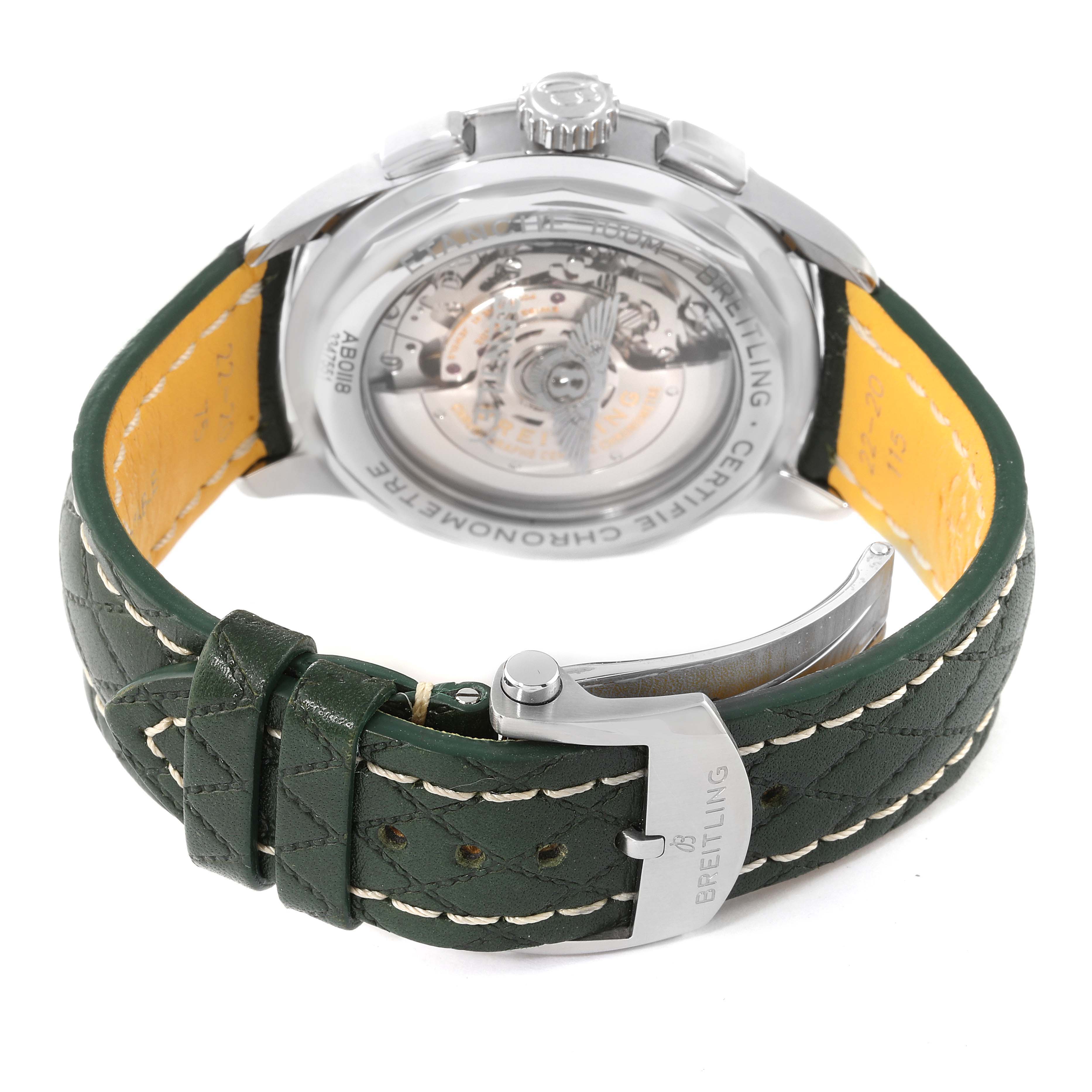 The image shows the back view of a Breitling Premier AB0118 Men
s Stainless Steel Green Dial AB0118 Men
s Stainless Steel Green Dial watch, highlighting its green leather strap and the exhibition case back.