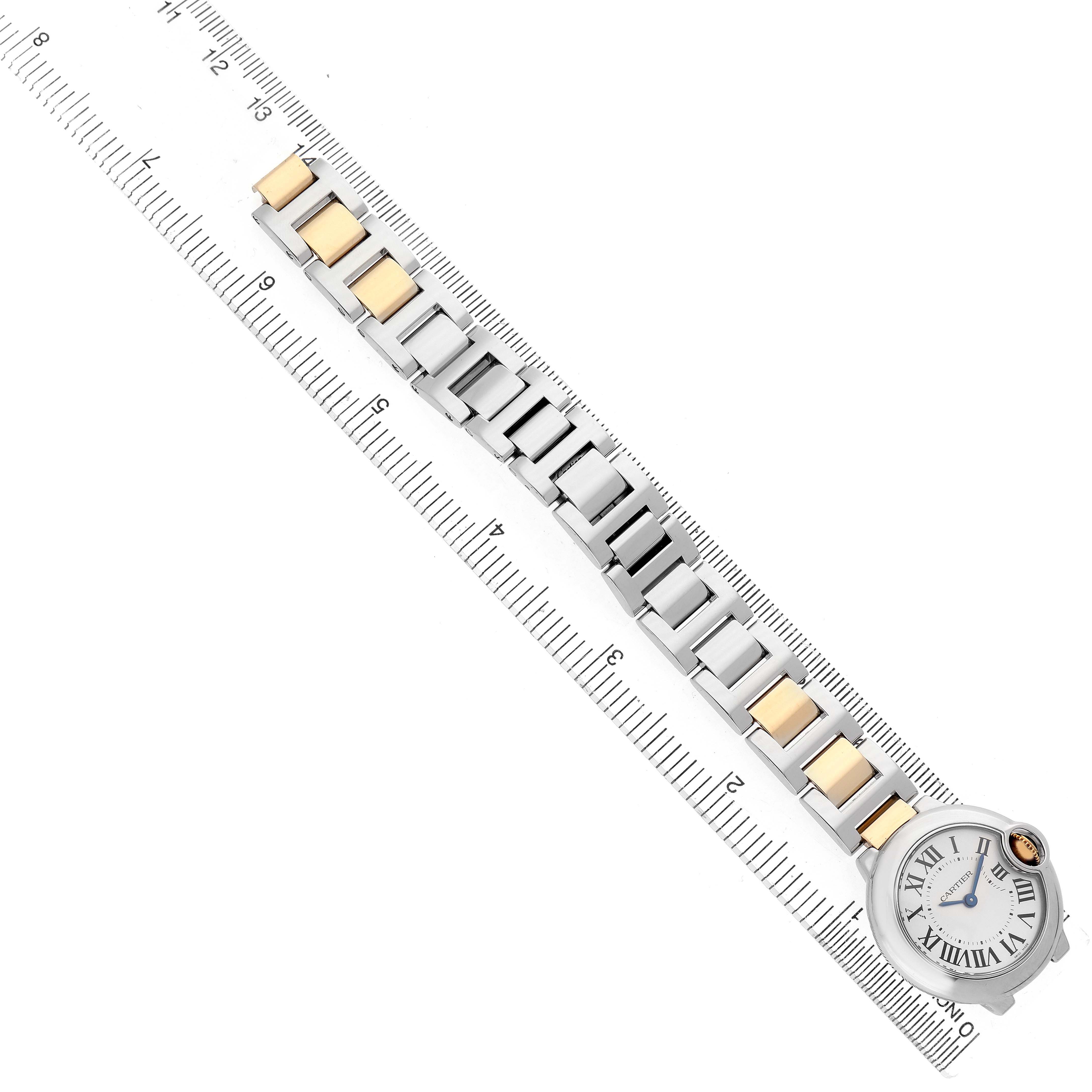 The Cartier Ballon Bleu W69007Z3 Women's Steel and Gold (two tone) Silver Dial watch is shown flat with its bracelet extended, placed alongside a measuring ruler.