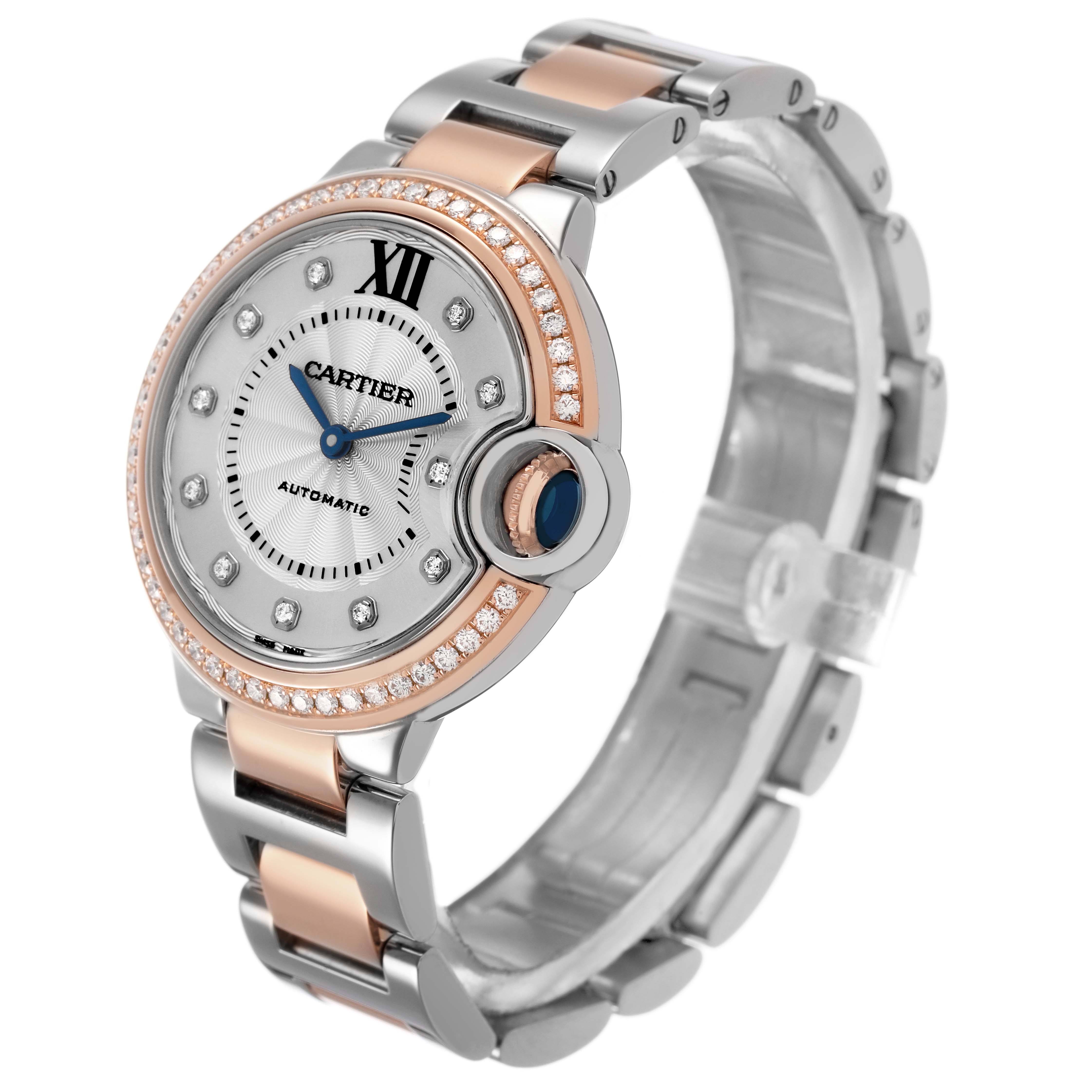The Ballon Bleu by Cartier is shown at a 3/4 angle, displaying its face, diamond-studded bezel, and metal bracelet with rose gold accents.