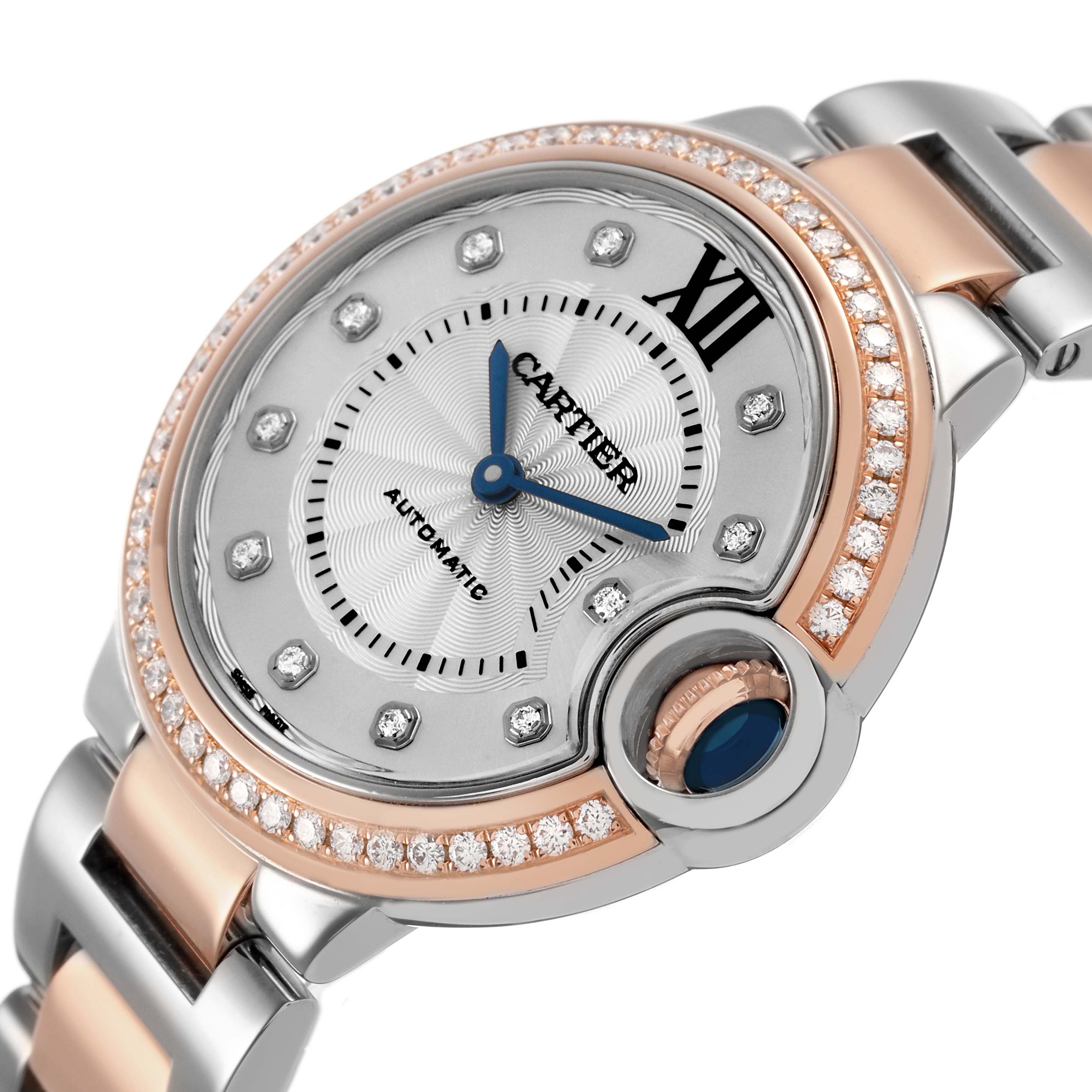 The Cartier Ballon Bleu WE902077 Women's Steel and Gold (two tone) Silver Dial watch is shown from a three-quarter angle, highlighting its face, bezel, and part of the bracelet.
