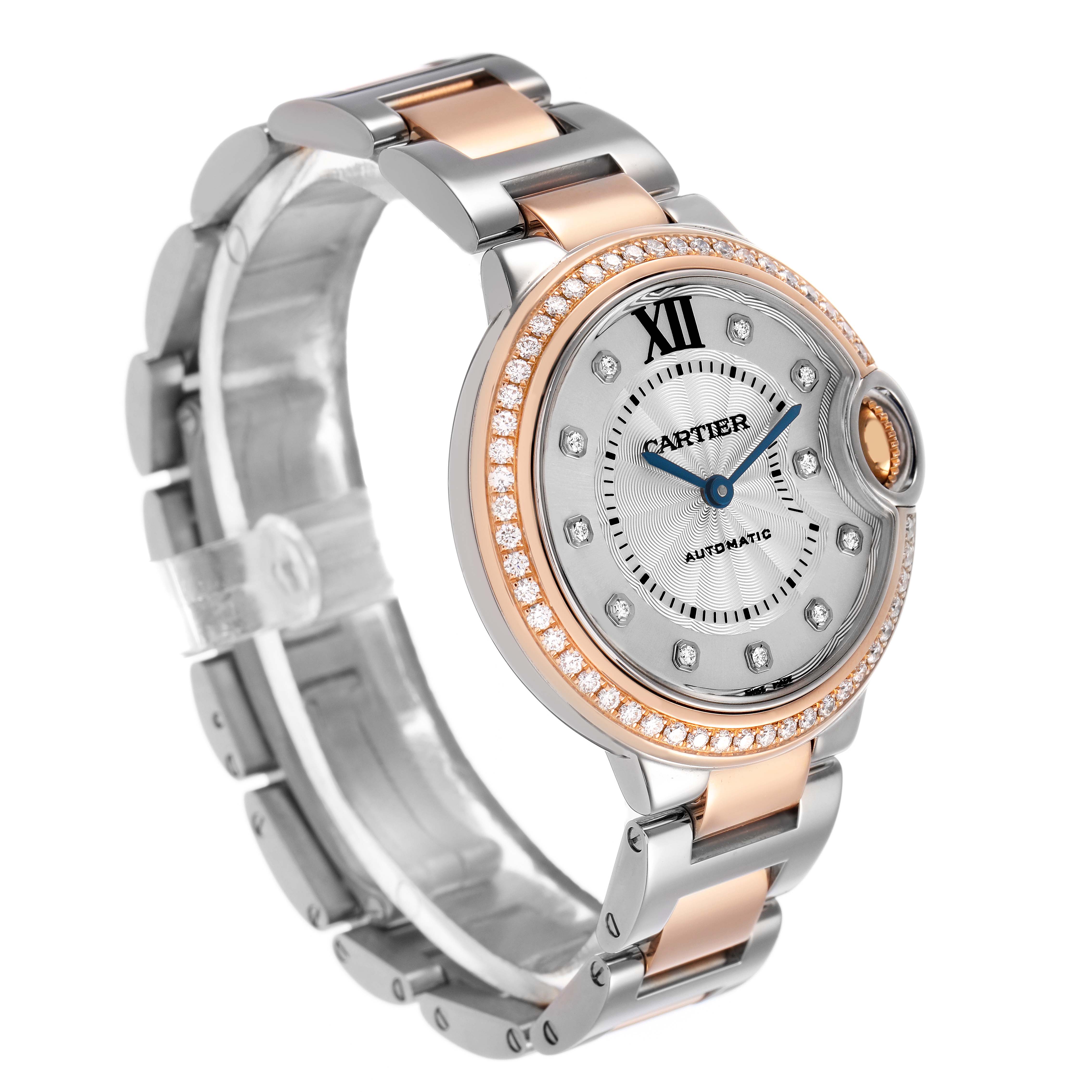 The Cartier Ballon Bleu WE902077 Women's Steel and Gold (two tone) Silver Dial watch is shown from a three-quarter angle, highlighting the dial, bezel, and bracelet.