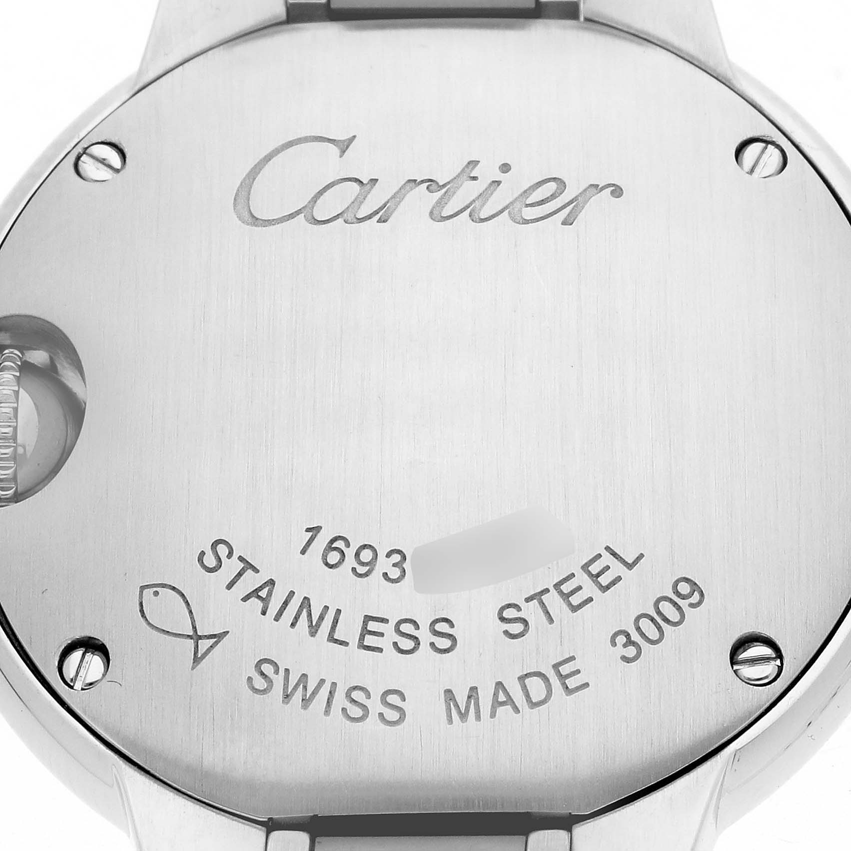 The image shows the back case of a Cartier Ballon Bleu W4BB0034 Women's Stainless Steel Silver Dial watch, highlighting the brand engraving and material details.
