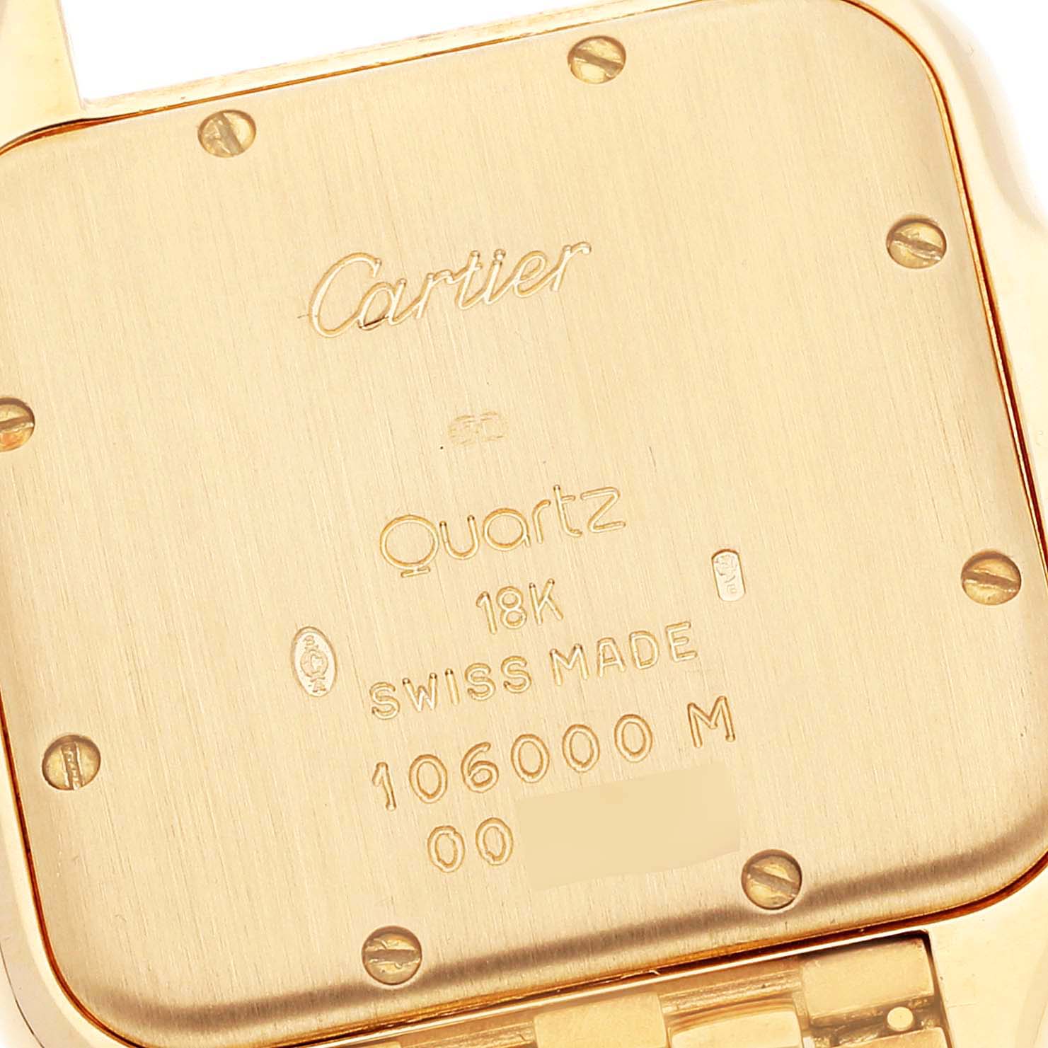 This image shows the back case of a Cartier Panthere W25014B9 Women's Yellow Gold Silver Dial W25014B9 Women's Yellow Gold Silver Dial model watch, highlighting its inscriptions and screws.