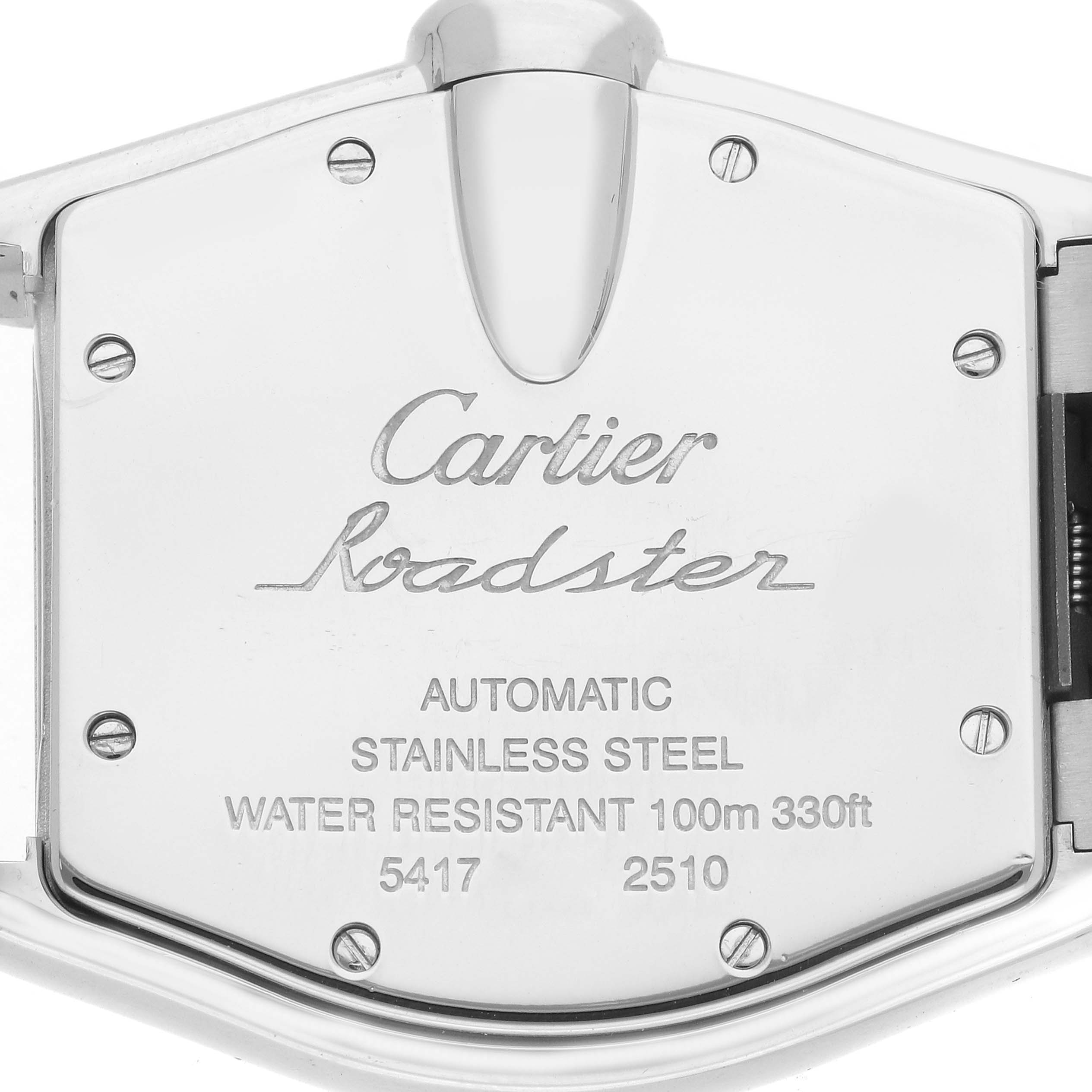 The image shows the case back of a Cartier Roadster W62025V3 Men
s Stainless Steel Silver Dial watch from a slightly angled view, highlighting specifications and branding.