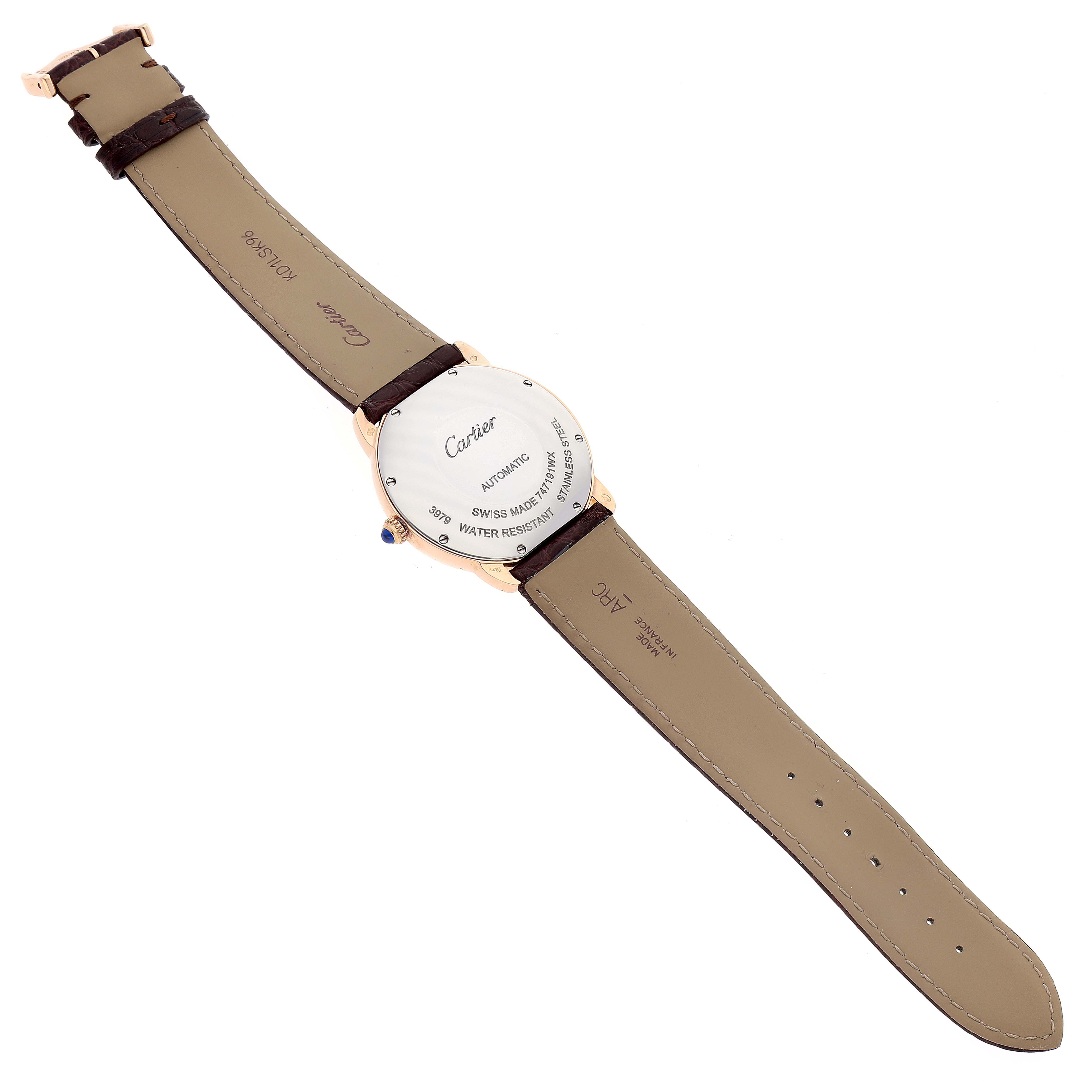 The Cartier Ronde W2RN0008 Men
s Rose Gold Silver Dial W2RN0008 Men
s Rose Gold Silver Dial watch is shown from the back, displaying the case back, crown, and leather straps.