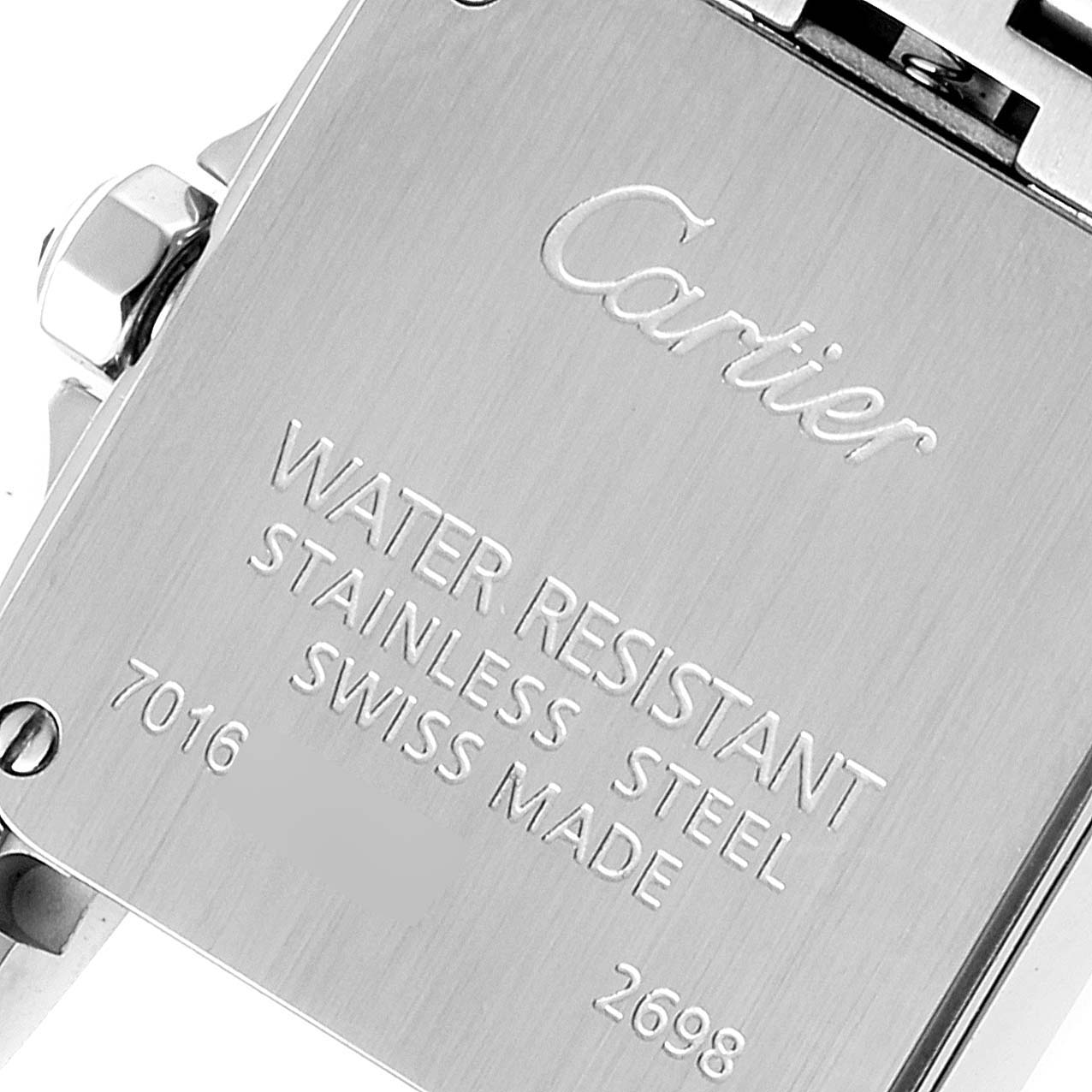 This image shows the back casing of the Santos Demoiselle model by Cartier, highlighting its engravings and water resistance.