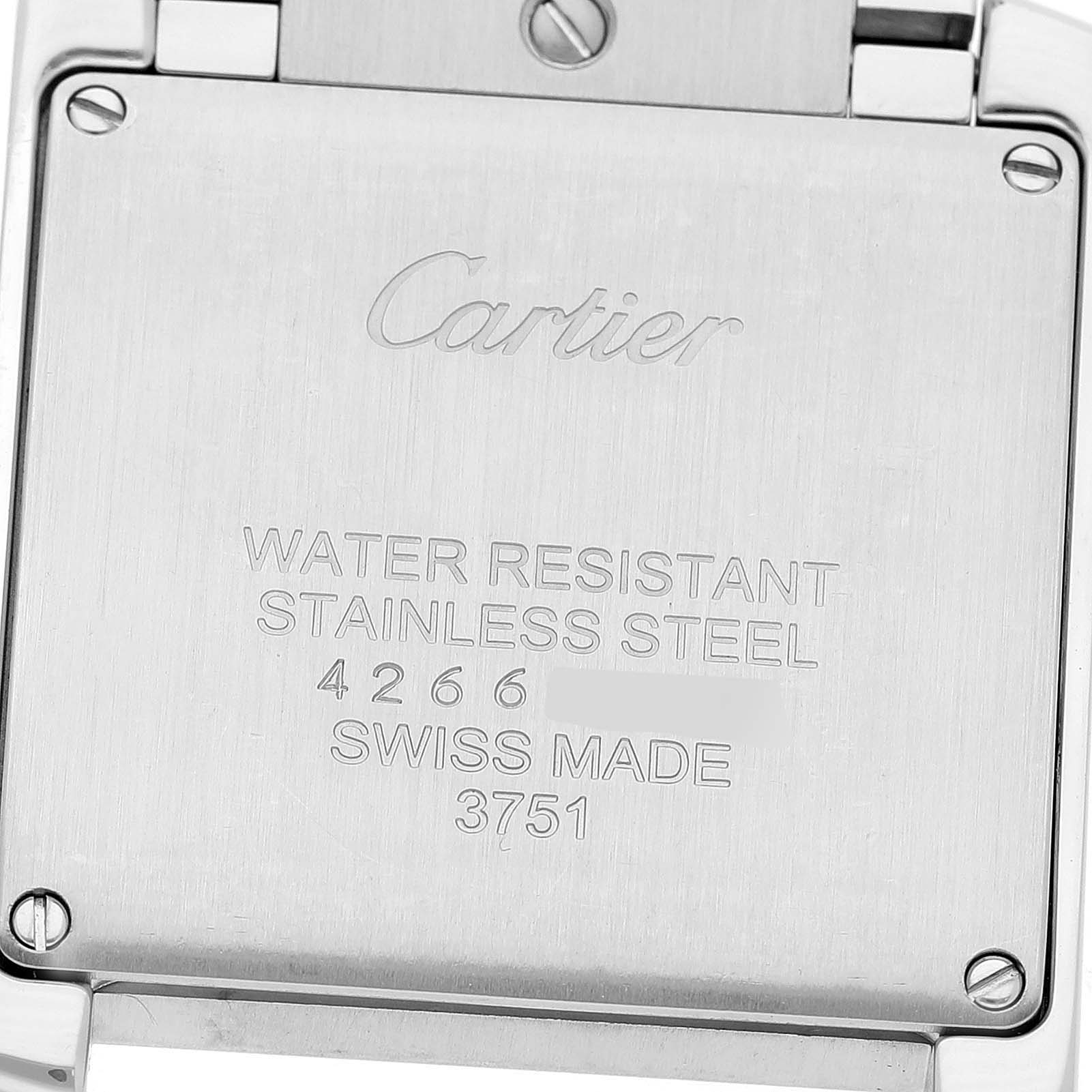 The image shows the back of the Cartier Tank Francaise W4TA0009 Women's Stainless Steel Silver Dial watch, featuring engravings on the stainless steel surface.