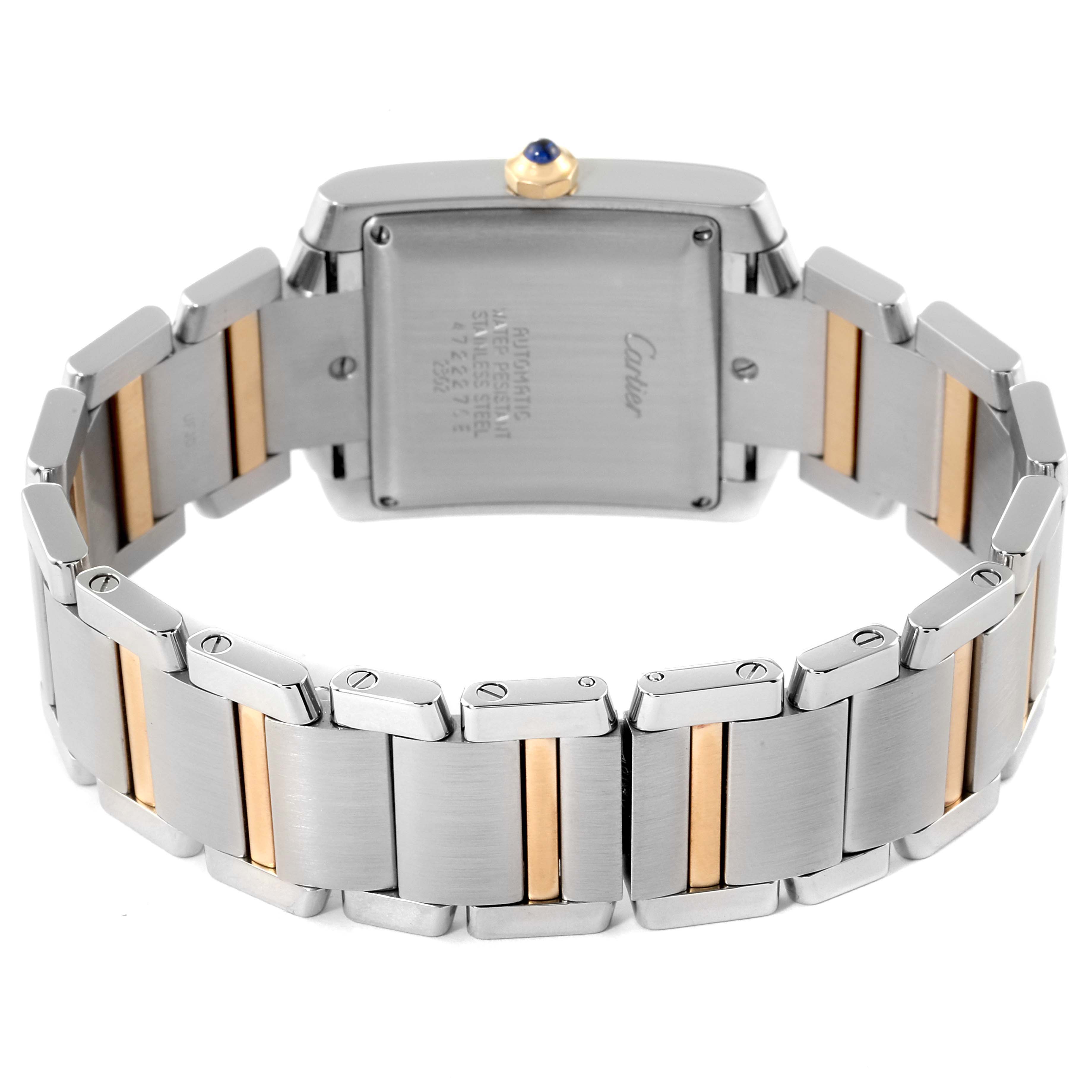 The image shows the back view of a Cartier Tank Française watch, highlighting the bracelet and case back with inscriptions.