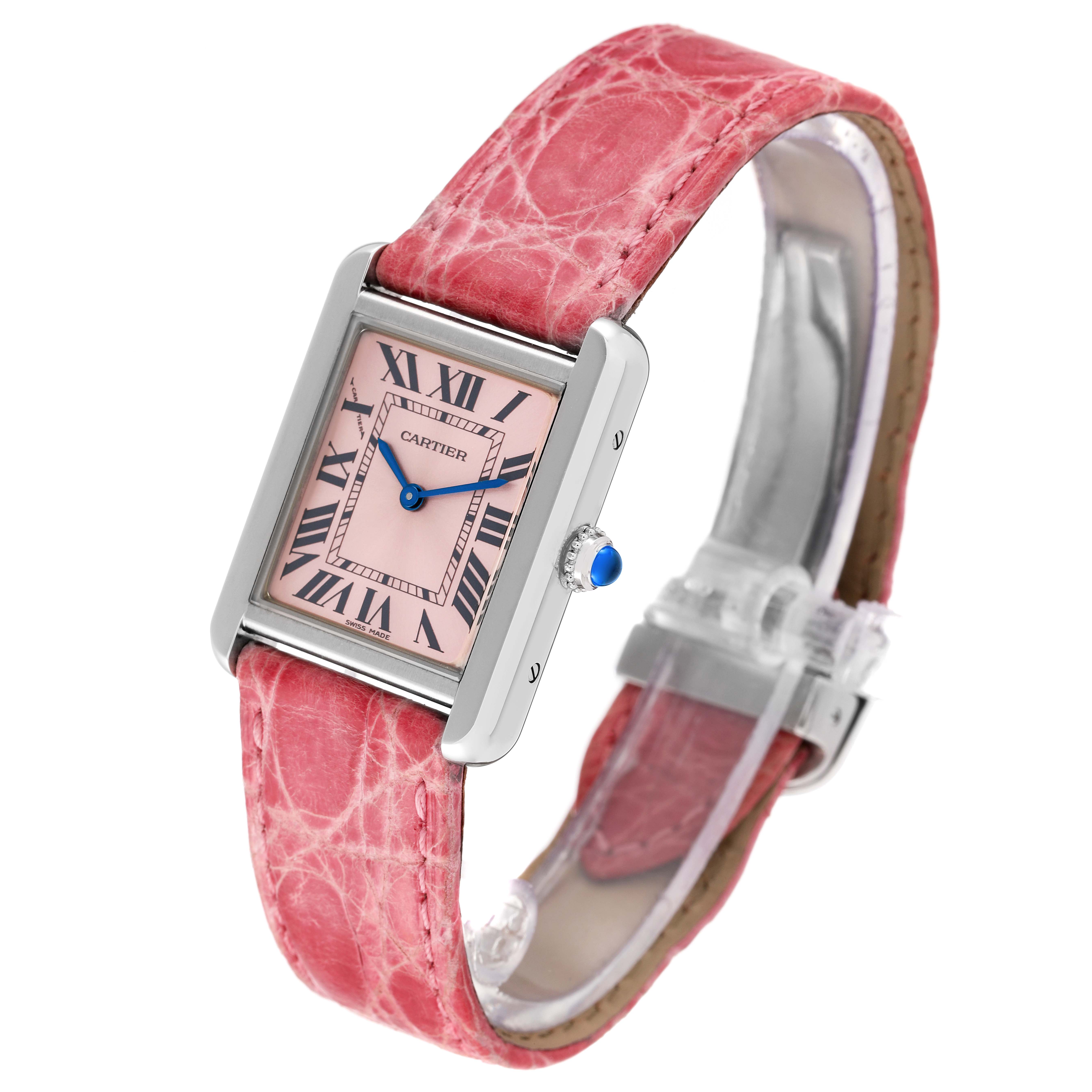 This Cartier Tank Solo W5200000 Women's Stainless Steel Pink Dial W5200000 Women's Stainless Steel Pink Dial model watch is shown at an oblique angle, highlighting its pink leather strap and rectangular face with Roman numerals.