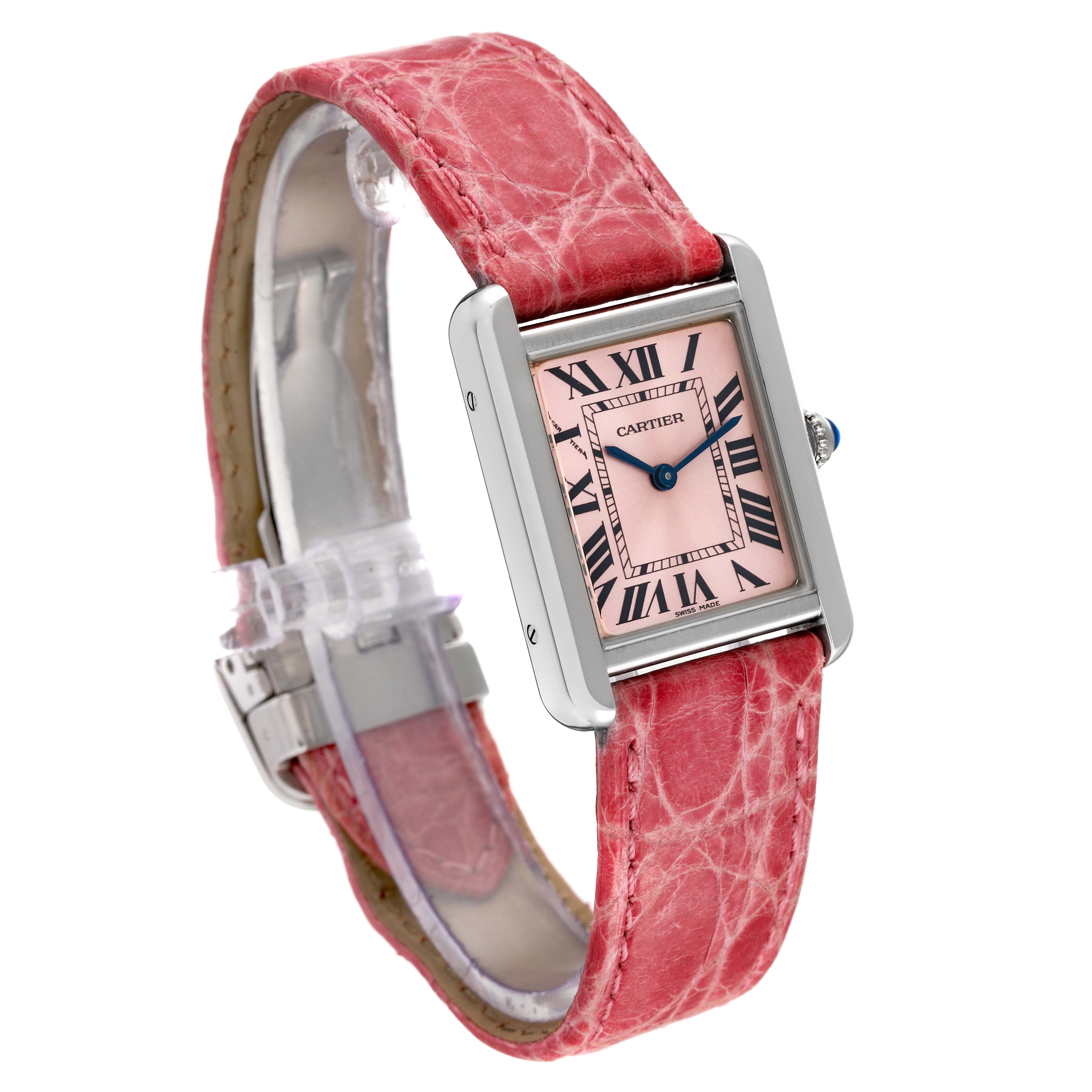 The image shows a Cartier Tank Solo W5200000 Women's Stainless Steel Pink Dial W5200000 Women's Stainless Steel Pink Dial watch at a three-quarter angle, highlighting its pink face, silver rectangular case, and red leather band.