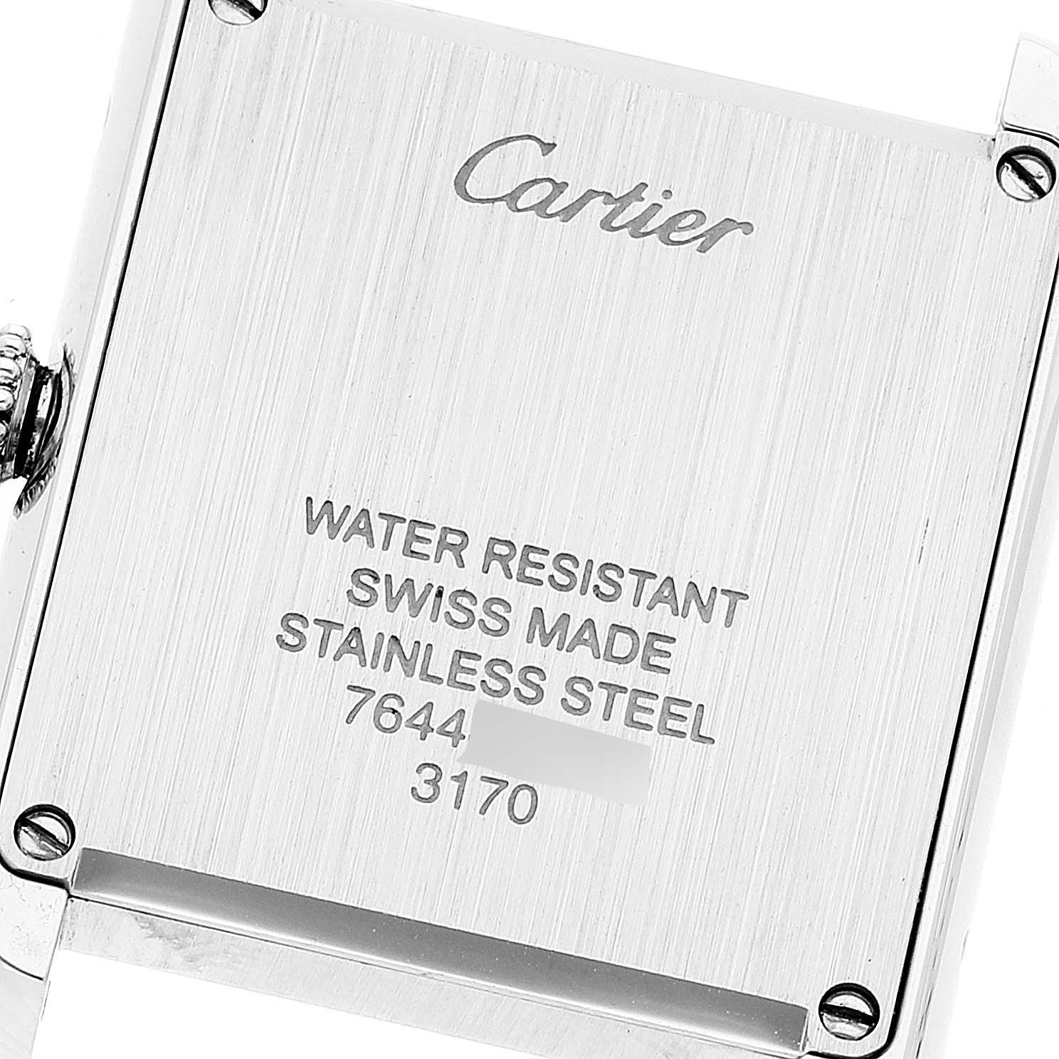 The image shows the back case of a Cartier Tank Solo W5200000 Women's Stainless Steel Pink Dial W5200000 Women's Stainless Steel Pink Dial watch, highlighting the inscriptions and materials.