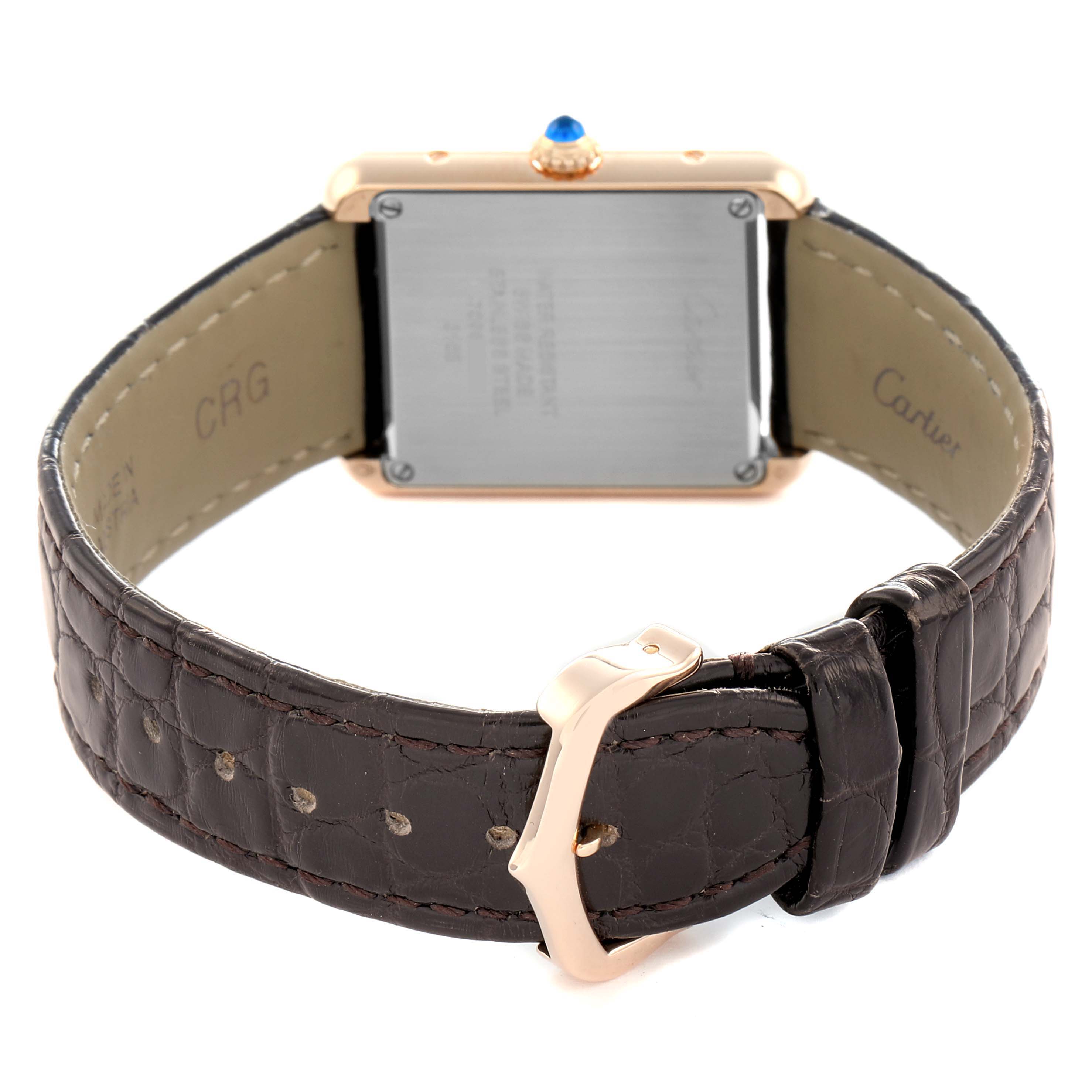 The Cartier Tank Solo W5200024 Women's Rose Gold Silver Dial watch is shown from the back, displaying its caseback and brown leather strap with a gold buckle.