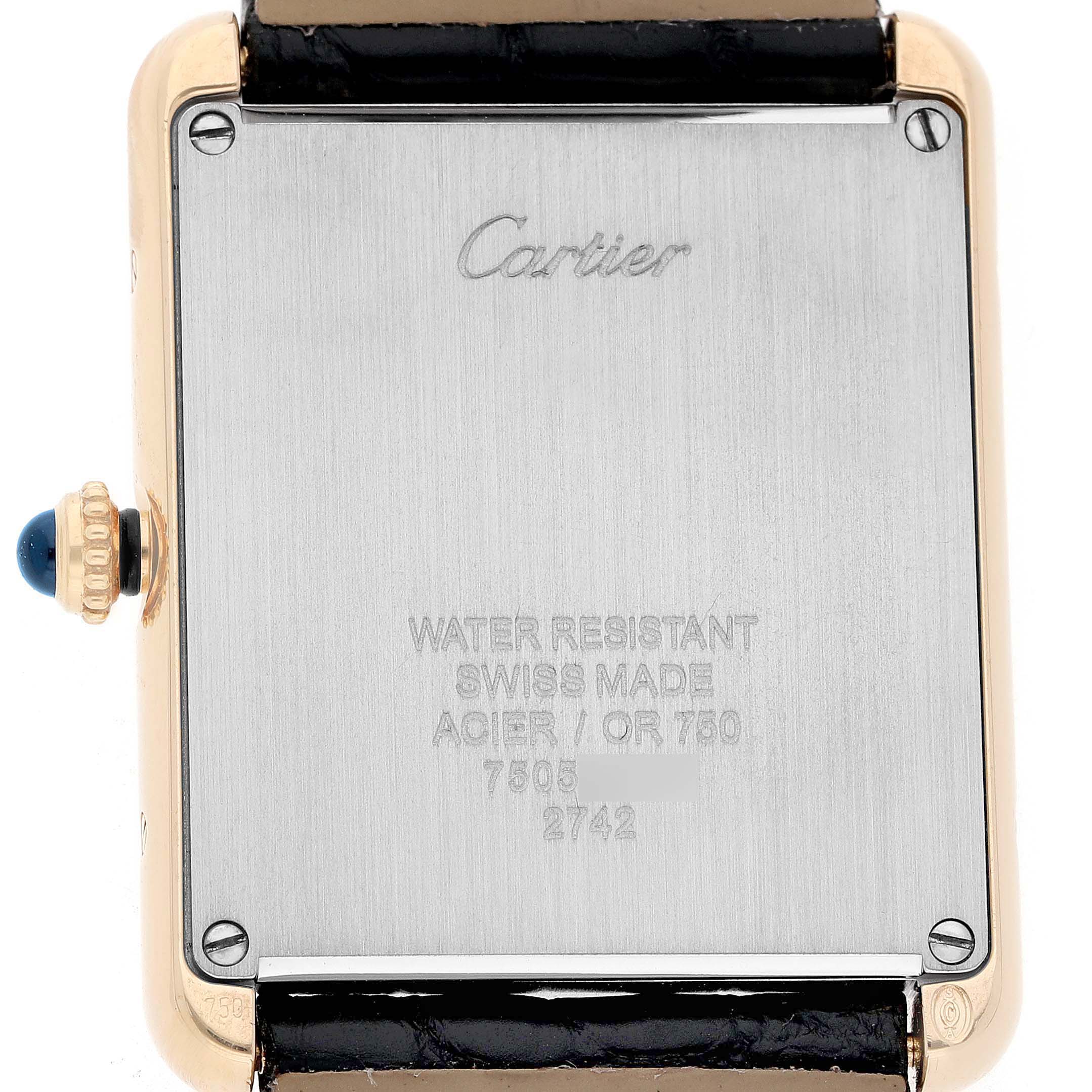 The image shows the back of a Cartier Tank Solo W1018855 Men's Steel and Gold (two tone) Silver Dial watch, highlighting the case back inscription and crown with a blue cabochon.