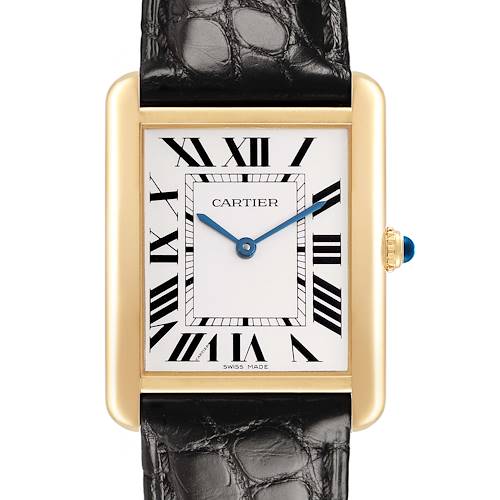 The Cartier Tank Solo W1018855 Men's Steel and Gold (two tone) Silver Dial watch is shown from the front, displaying its face, black leather strap, and gold case with a blue gemstone crown.