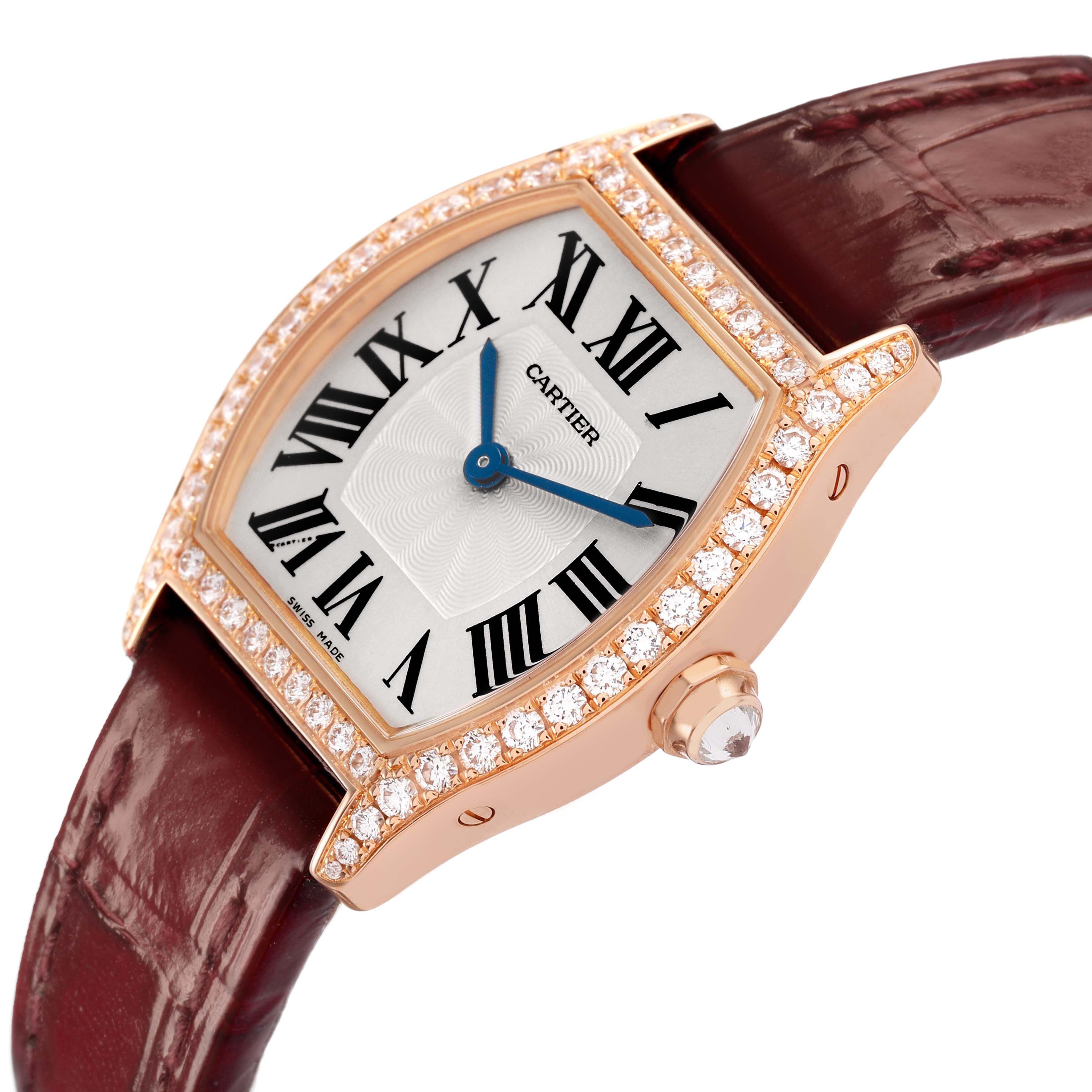 The Cartier Tortue WA501010 Women's Rose Gold Silver Dial watch is shown at an angled view, highlighting the diamond-studded bezel and brown leather strap.
