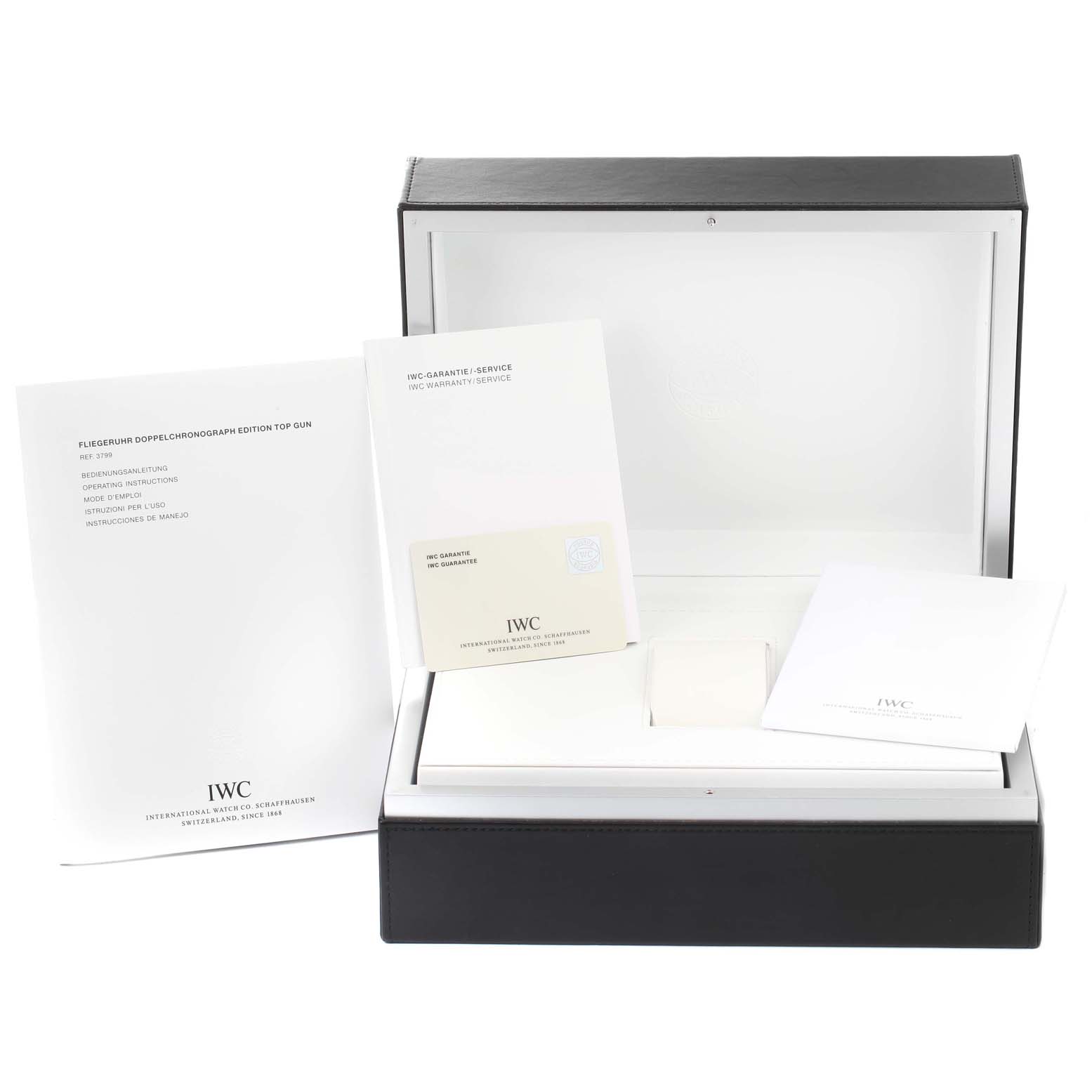 The image shows the packaging, warranty card, and manuals for the IWC Pilot IW379901 Men's Ceramic Black Dial IW379901 Men's Ceramic Black Dial model watch.