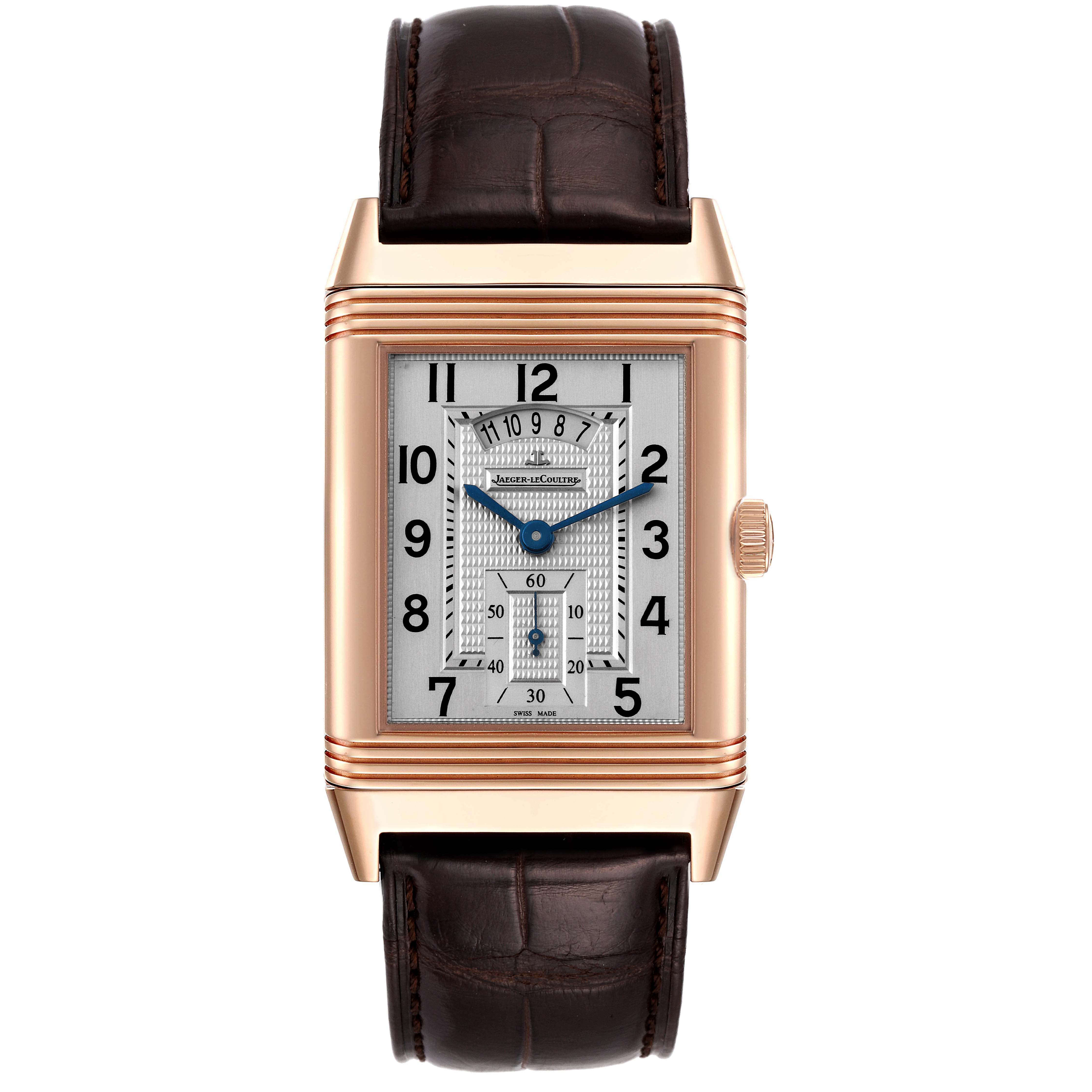 The image shows a front view of the Jaeger-LeCoultre Reverso watch, highlighting its rectangular dial, crown, and leather strap.