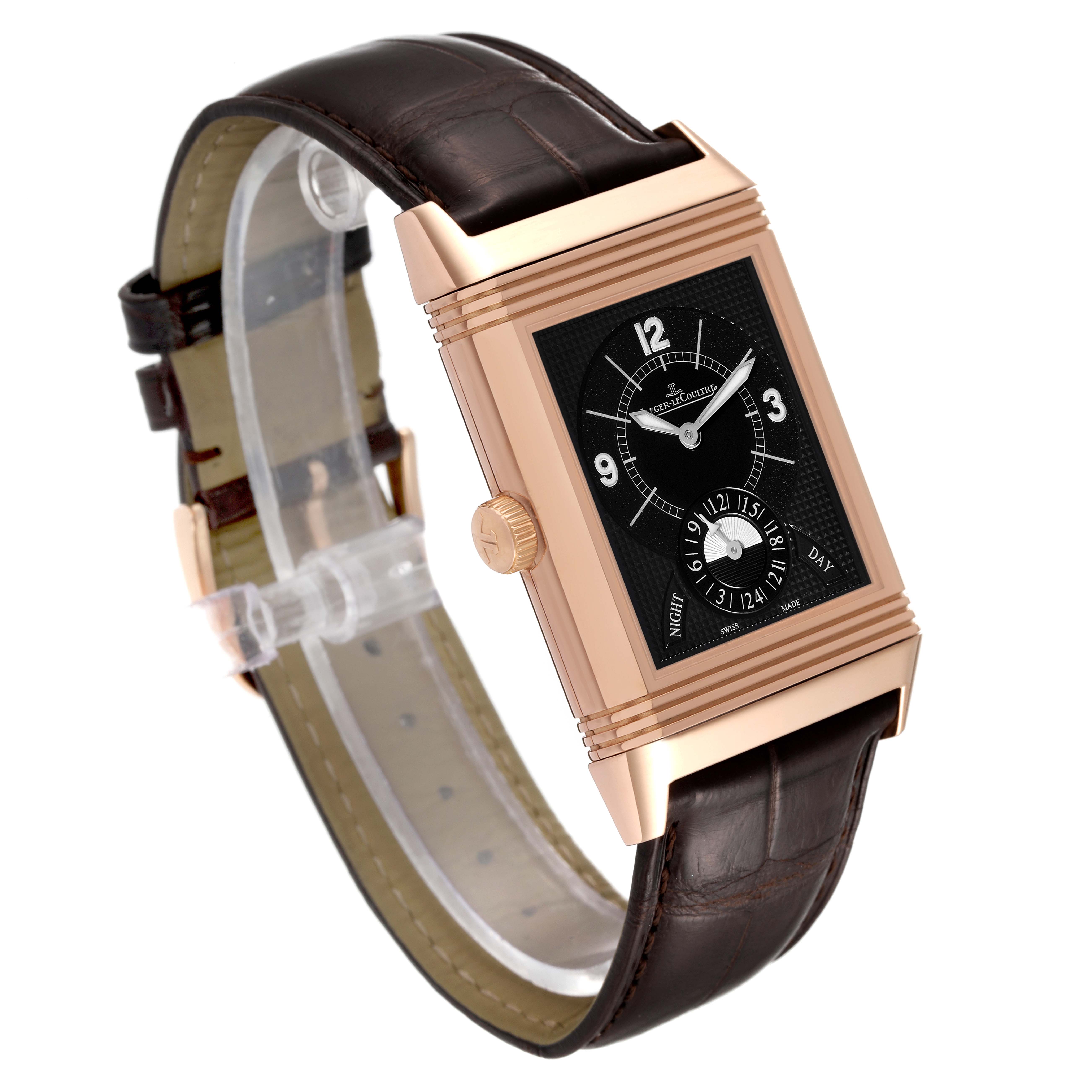 The image shows a Jaeger LeCoultre Reverso Q3742521 Men
s Rose Gold Silver Dial Q3742521 Men
s Rose Gold Silver Dial watch, angled to highlight the face, crown, and brown leather strap.