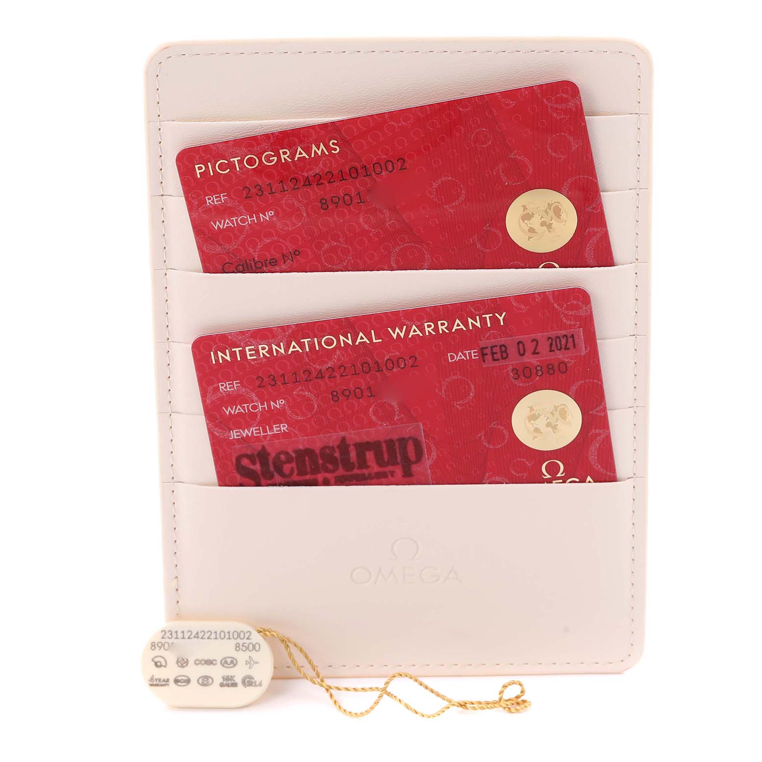 The image shows Omega Aqua Terra 231.12.42.21.01.002 Men
s Stainless Steel Black Dial model warranty cards and a tag in a white holder, viewed from the front.