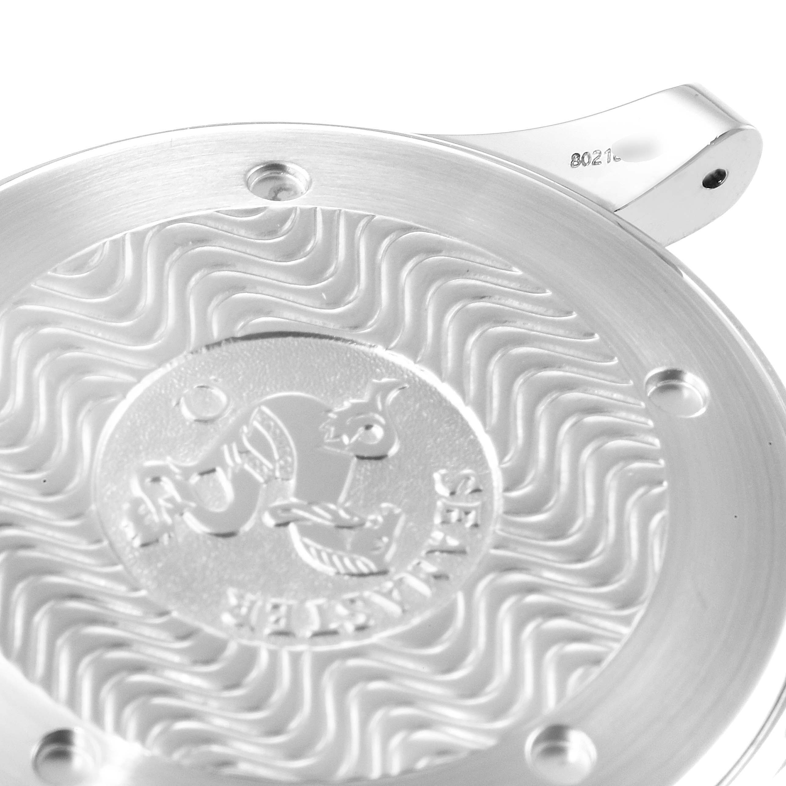 The image shows a close-up of the case back for the Omega Seamaster 2254.50.00 Men's Stainless Steel Black Dial 2254.50.00 Men's Stainless Steel Black Dial watch, featuring the engraved logo and wave pattern.