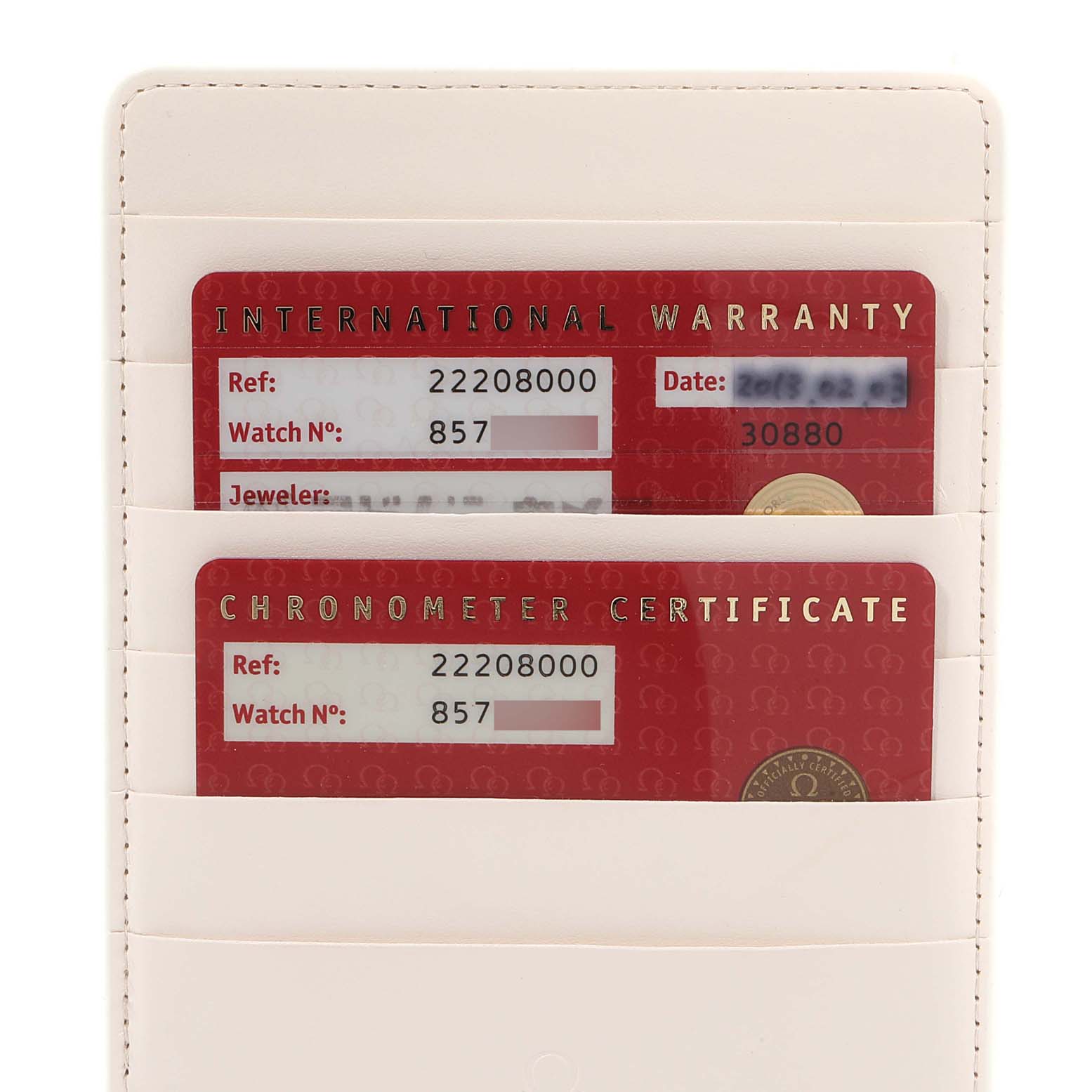 The image shows the warranty and chronometer certification cards for an Omega Seamaster 2220.80.00 Men
s Stainless Steel Blue Dial 2220.80.00 Men
s Stainless Steel Blue Dial watch enclosed in a cardholder.