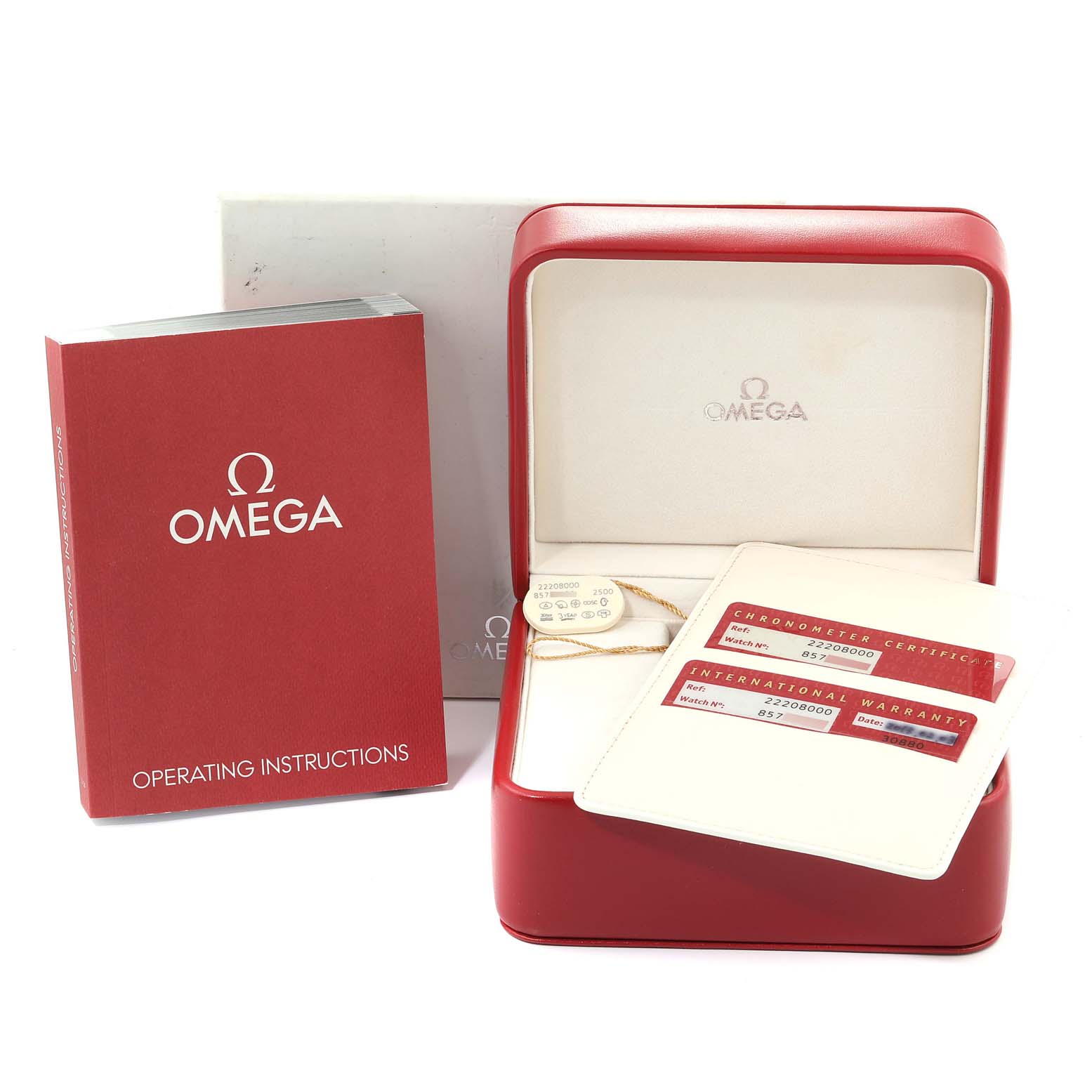 The image shows accessories of the Omega Seamaster 2220.80.00 Men
s Stainless Steel Blue Dial 2220.80.00 Men
s Stainless Steel Blue Dial watch, including an operating manual, warranty cards, and a display box at an angle.