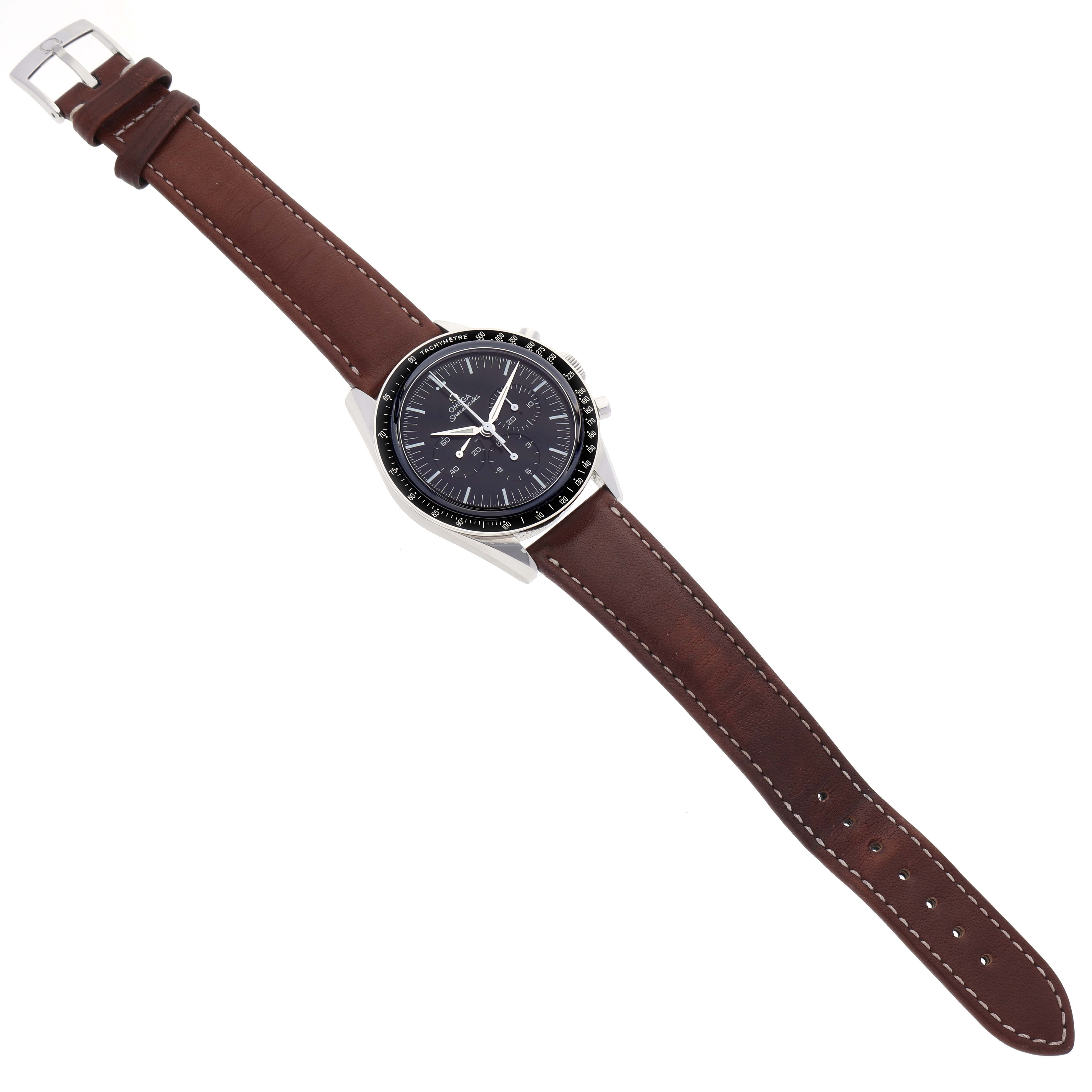 The image displays an Omega Speedmaster 311.32.40.30.01.001 Men's Stainless Steel Black Dial 311.32.40.30.01.001 Men's Stainless Steel Black Dial watch from a top-down angle, showcasing its dial, case, and brown leather strap.