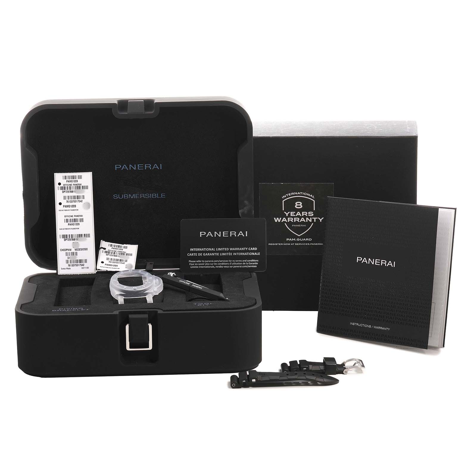 The image shows the open packaging of a Panerai Submersible PAM01209 Men's Stainless Steel Black Dial watch, including accessories like a strap, tools, and warranty cards.
