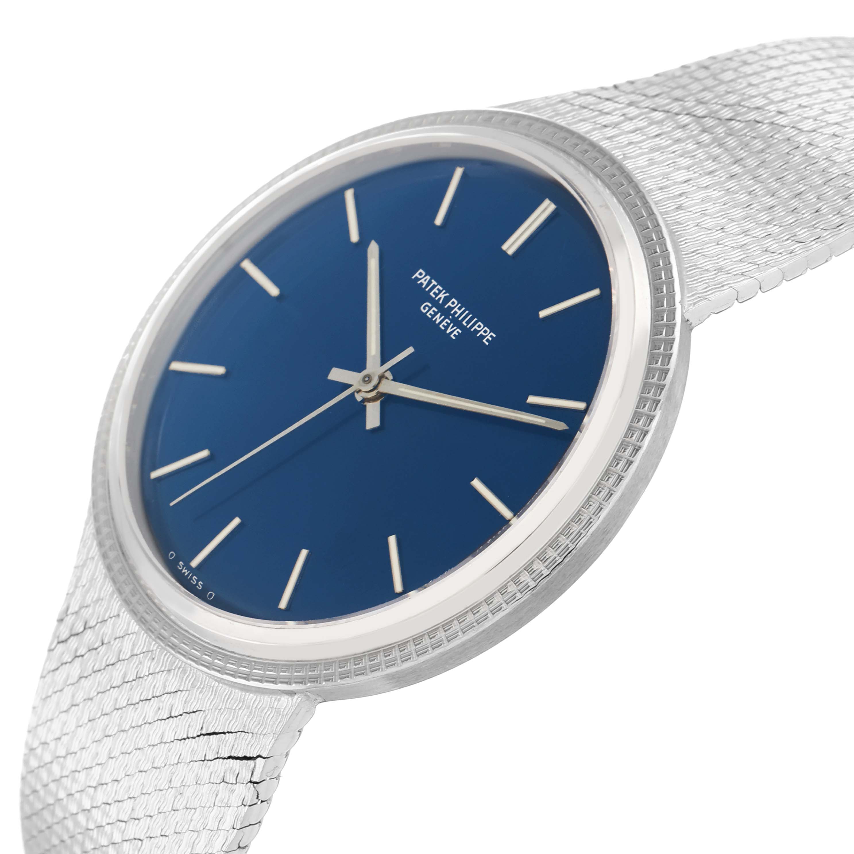 The image shows a side angle of a Patek Philippe Vintage 3569 Men
s White Gold Blue Dial model, highlighting the blue dial, silver indices, and textured metal bracelet.