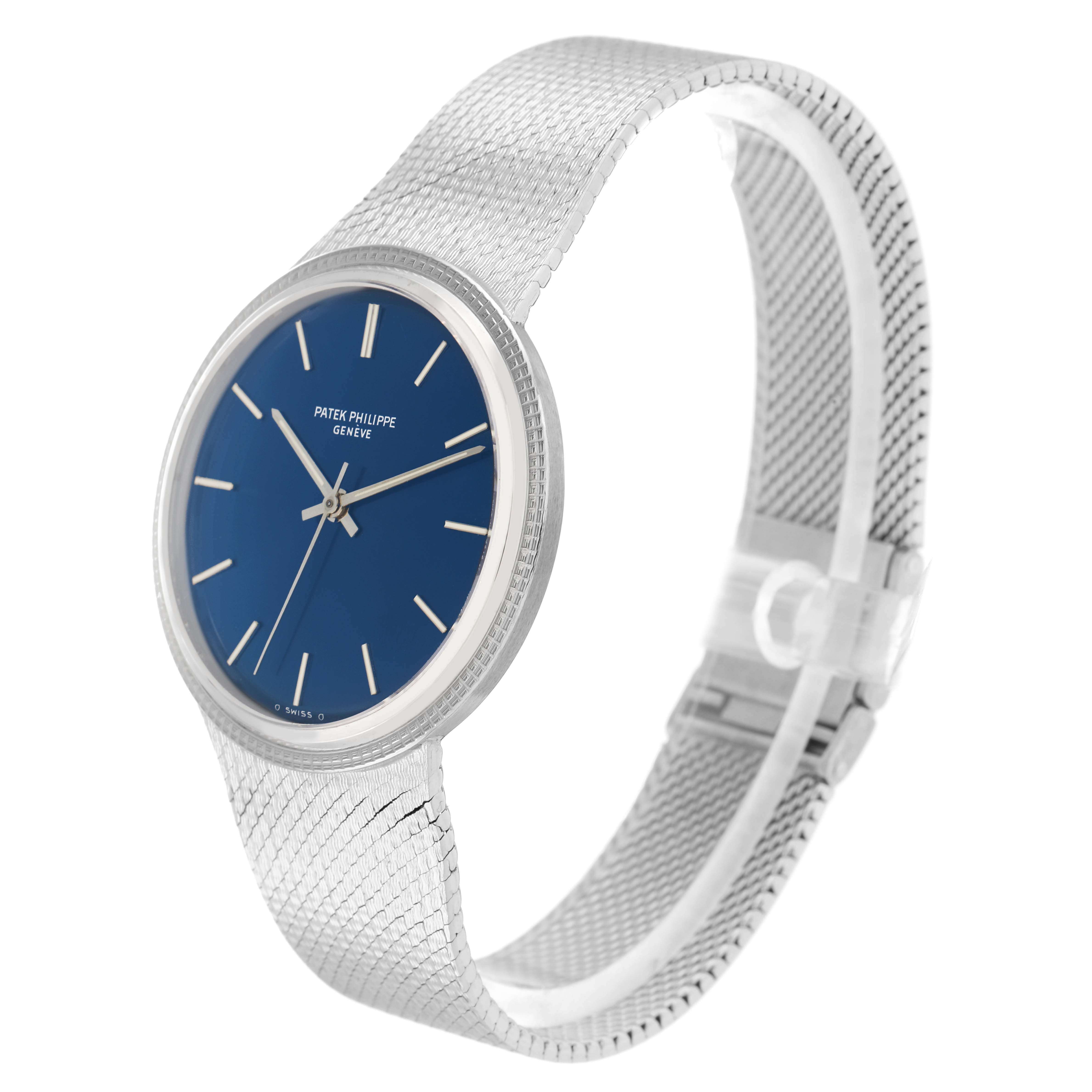 The Vintage Patek Philippe watch is angled to show the face, bracelet, and clasp, highlighting its blue dial and metal mesh band.