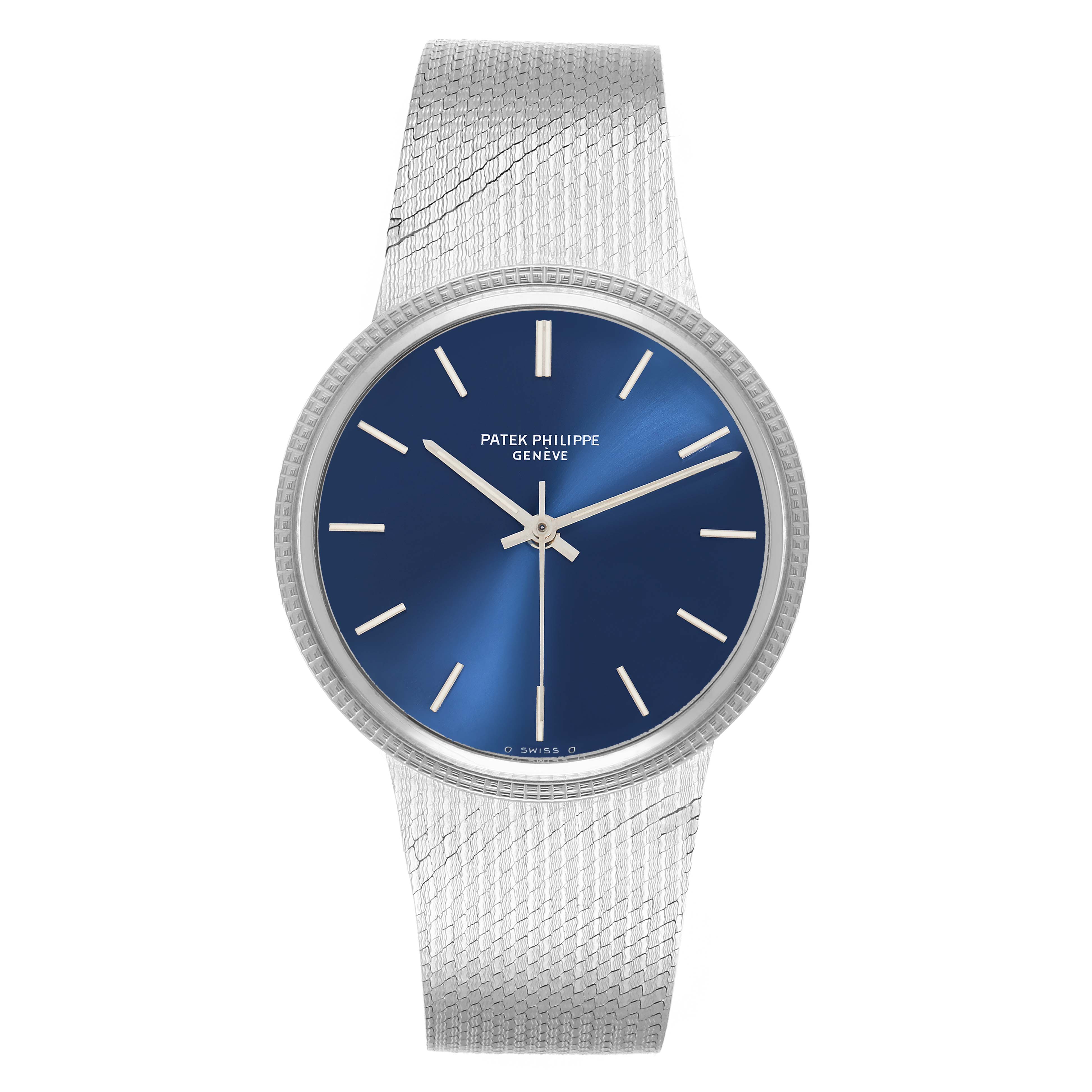 The Patek Philippe Vintage 3569 Men
s White Gold Blue Dial watch is shown from a top-down angle, displaying its blue face, silver hands, and mesh band.