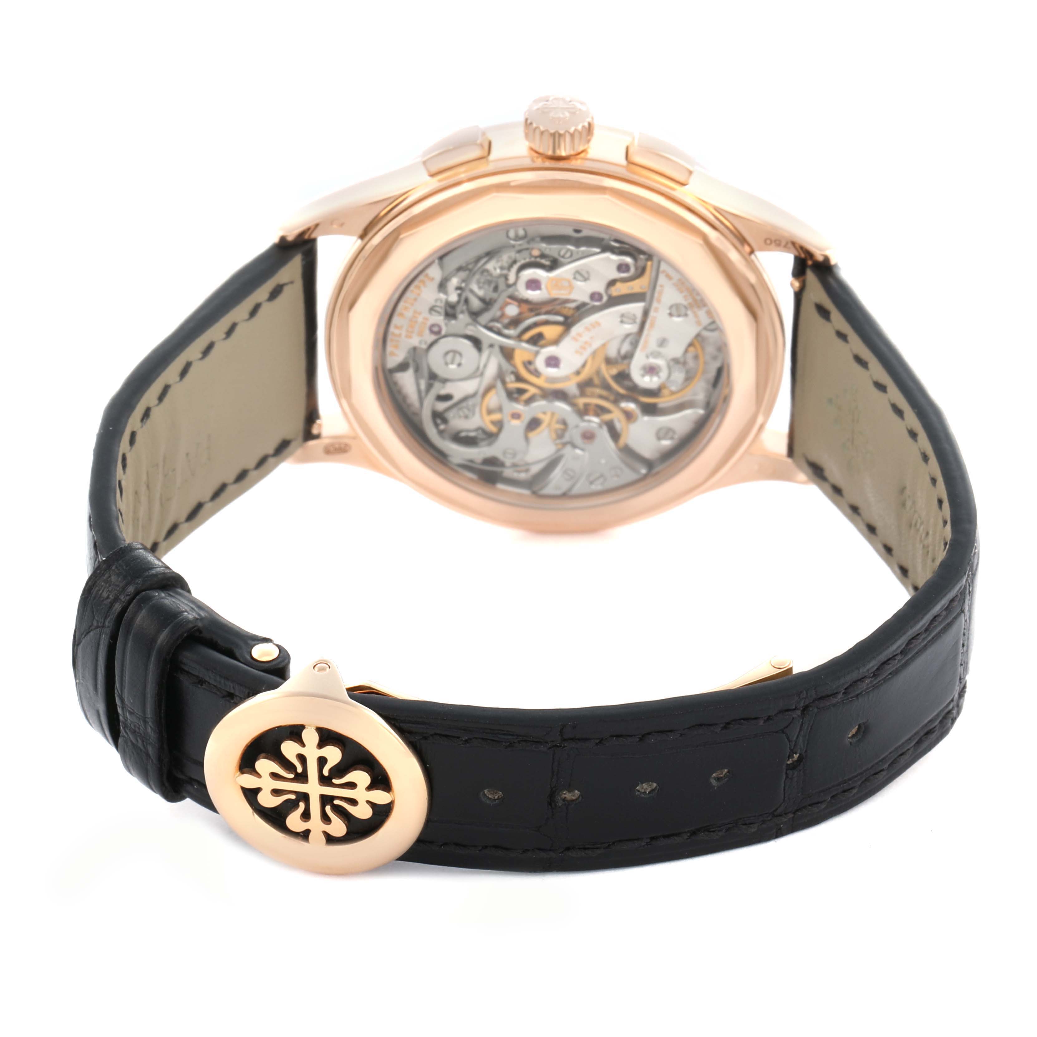 The Patek Philippe Complications 5170 Men
s Rose Gold Black Dial watch is shown from the back, highlighting its movement and black leather strap with a rose gold clasp.